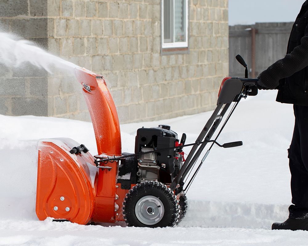 Worker Removing Snow