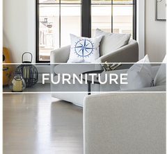 Living room scene with light-colored sofa, pillows, and a window. Text overlay reads