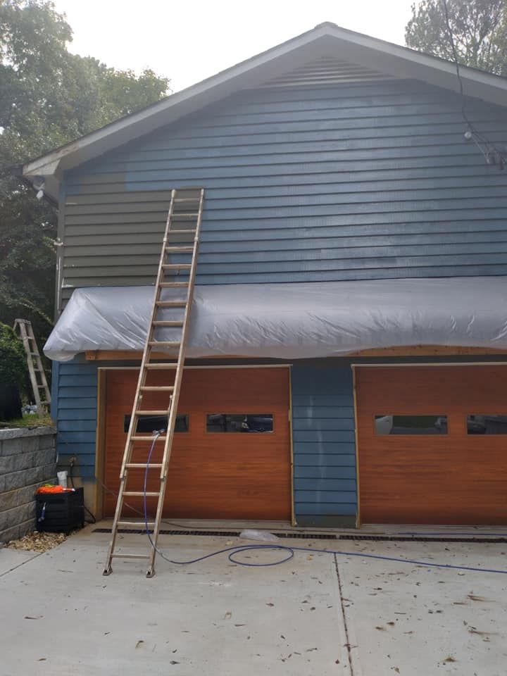 A ladder is leaning against the side of a house