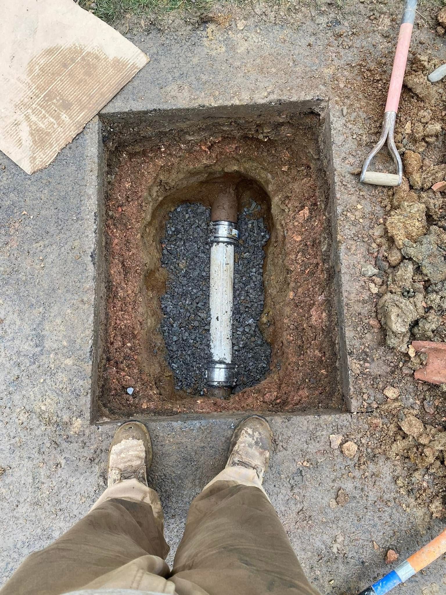 A close up of a hose with a gauge attached to it.
