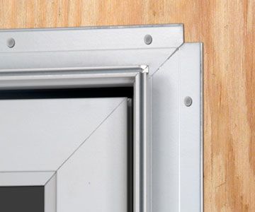A door frame that has a nail fin which is similar to what is on a window at time of new construction