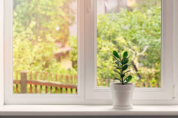 Window sill sitting under a vinyl window.