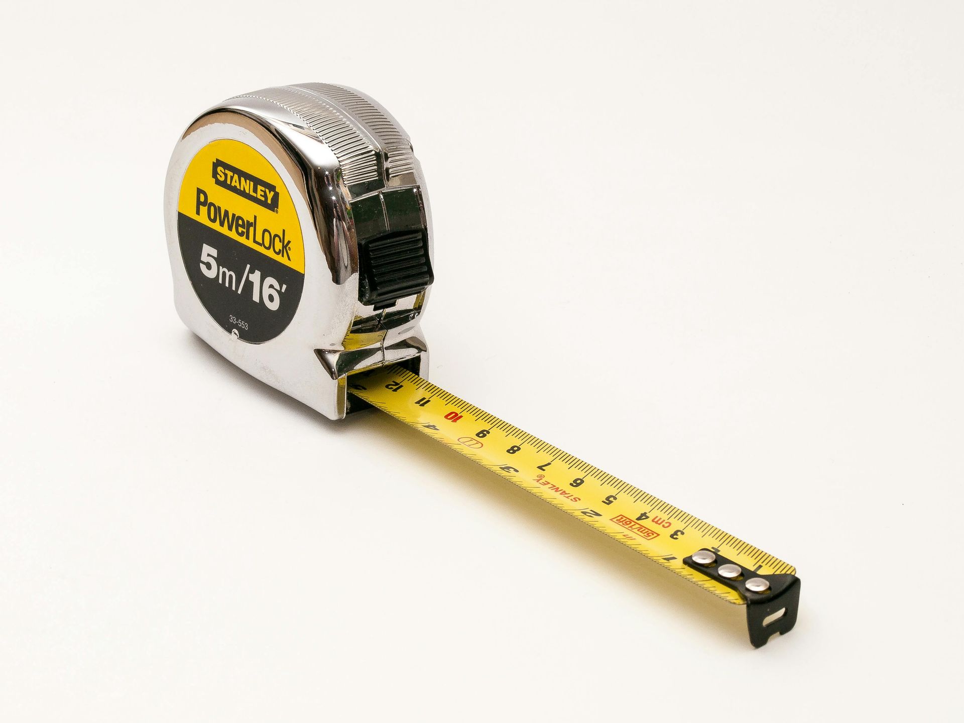 A tape measure to measure window and door openings on a home.