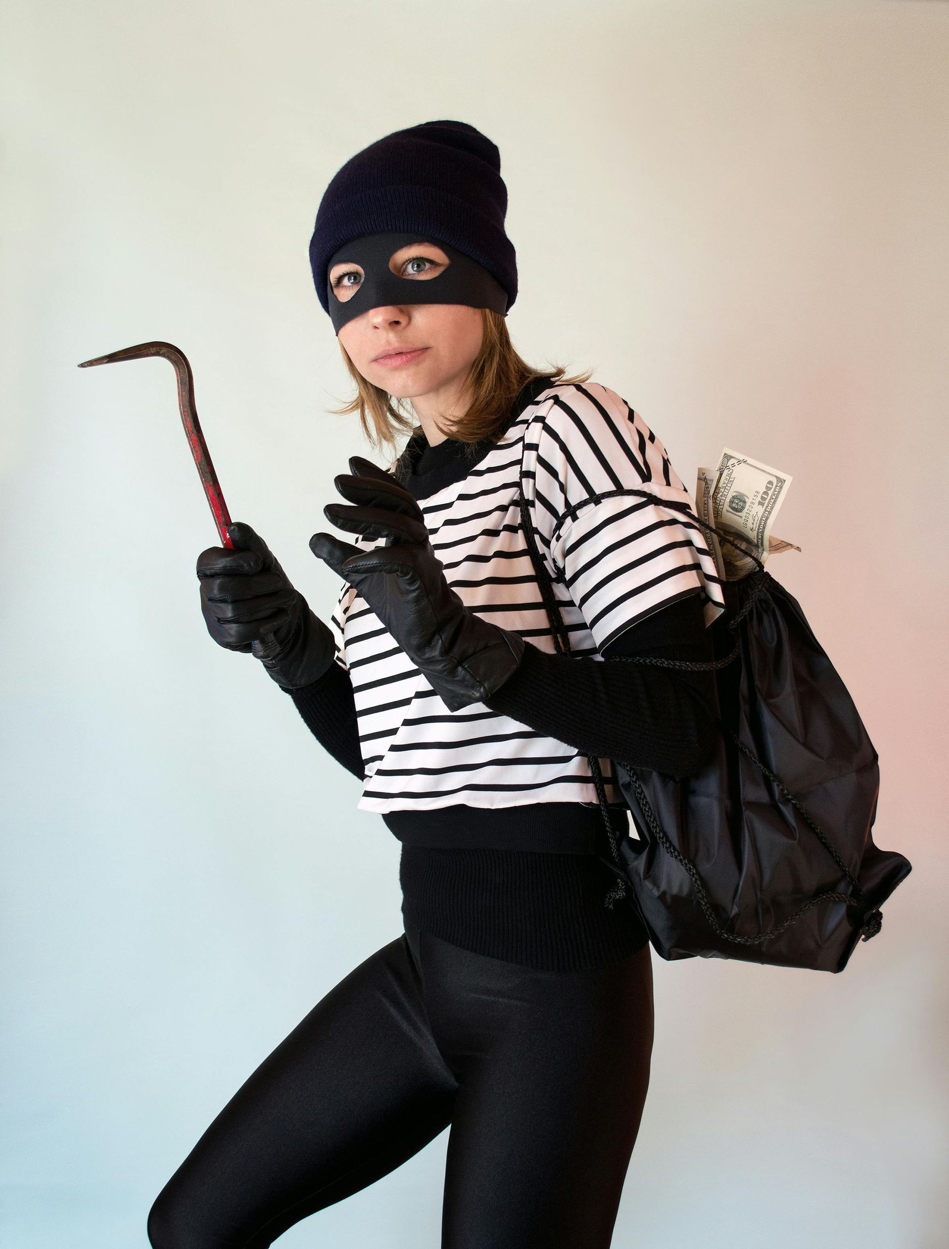 A burglar on their way to break into a home with vinyl windows.