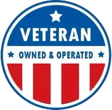 a veteran owned and operated sign with an american flag in the background