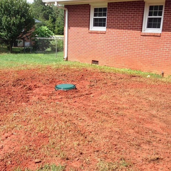 Newly Installed Septic Tank Beside the House — Anderson, SC — A&R Septic Tank Cleaning