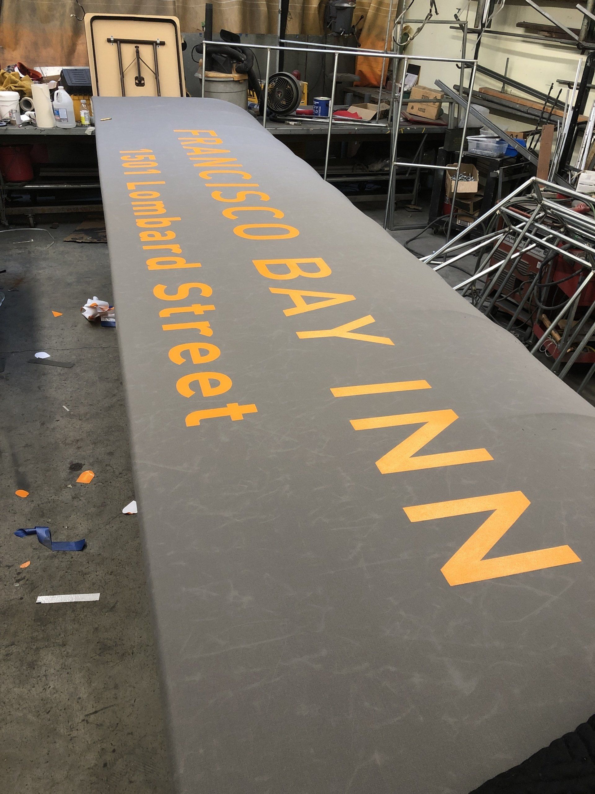 A large sign that says ' san francisco bay inn ' on it