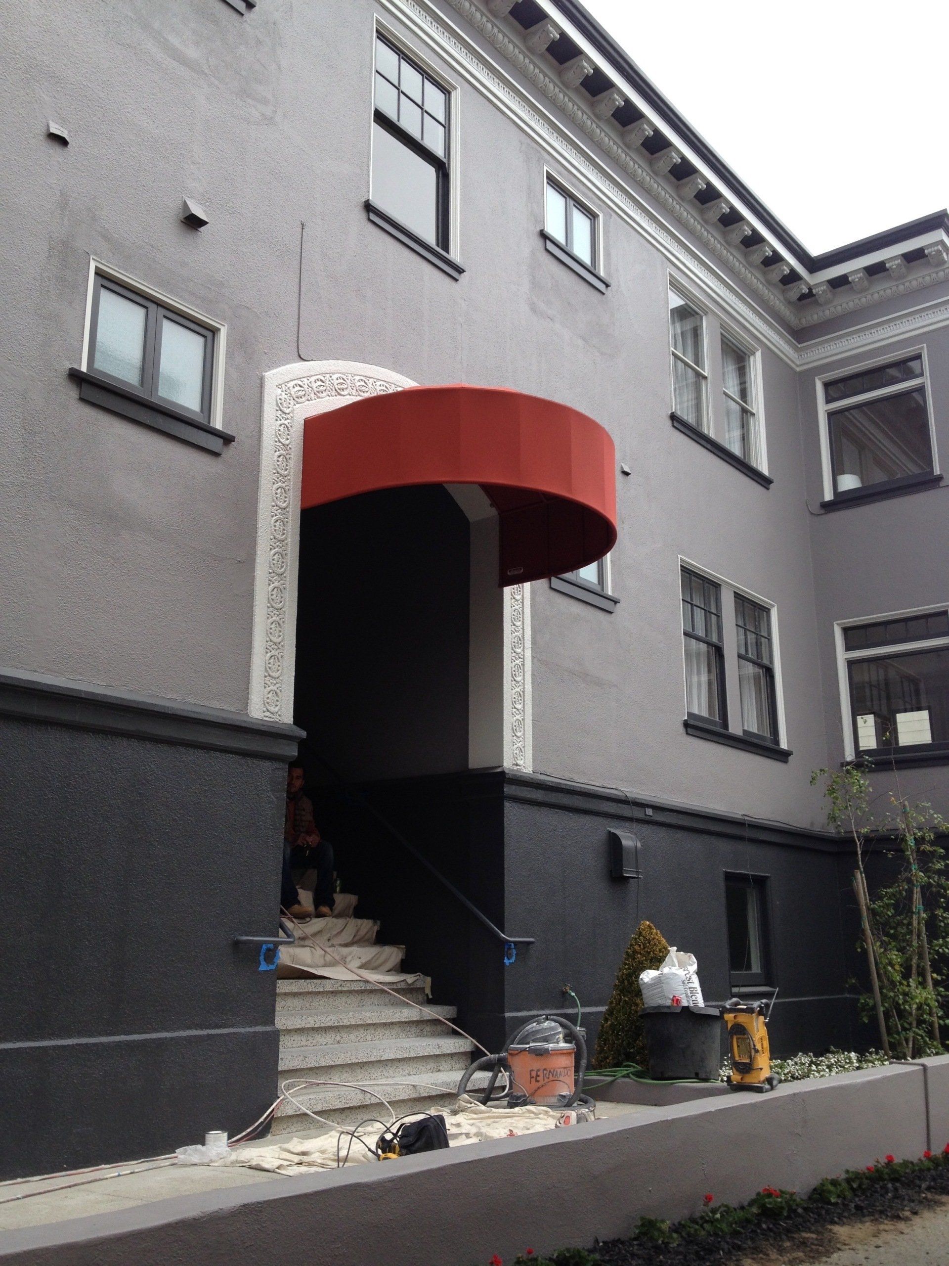 A building with a red awning over the entrance