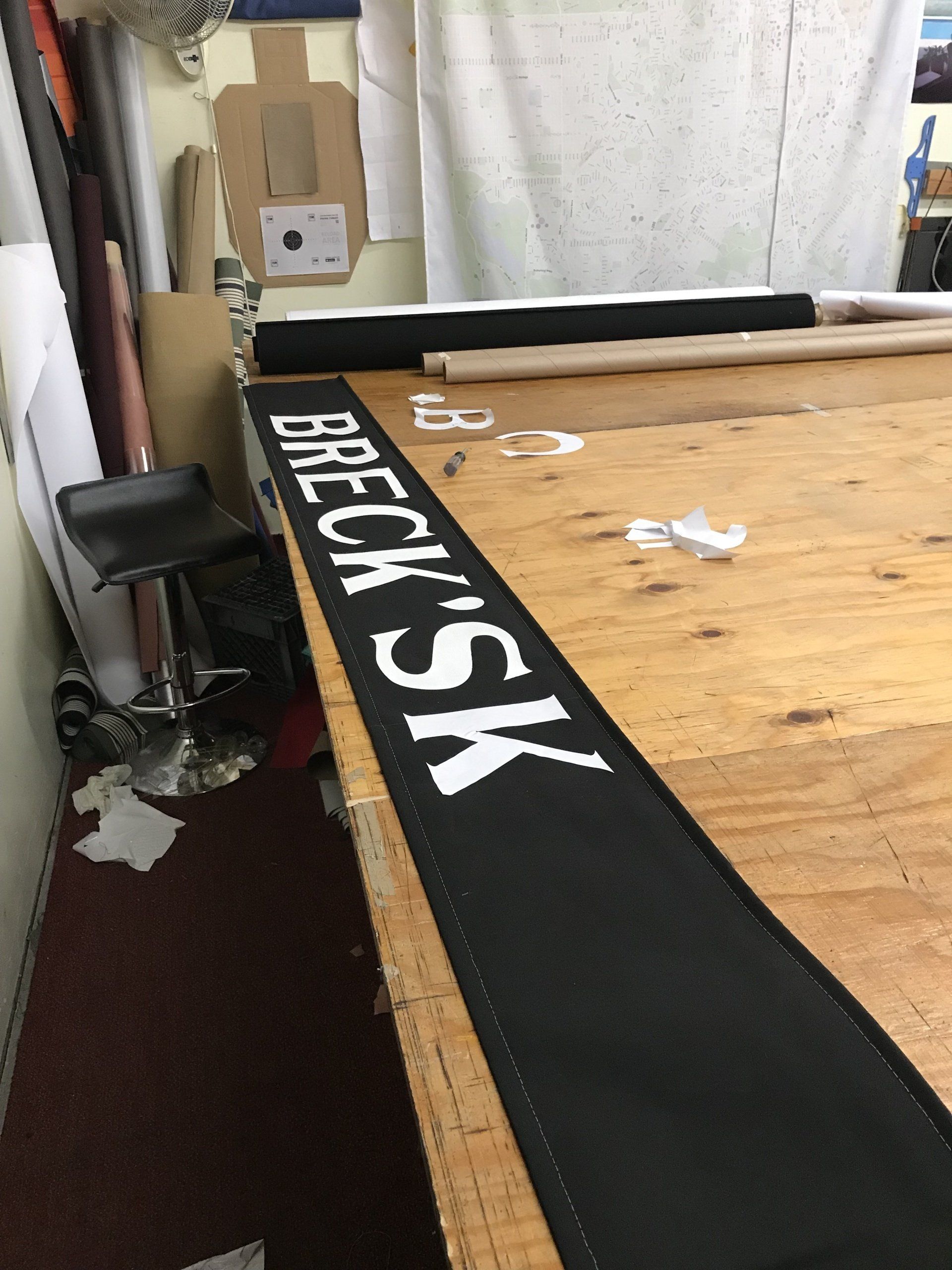 A wooden table with a sign that says breck sk on it