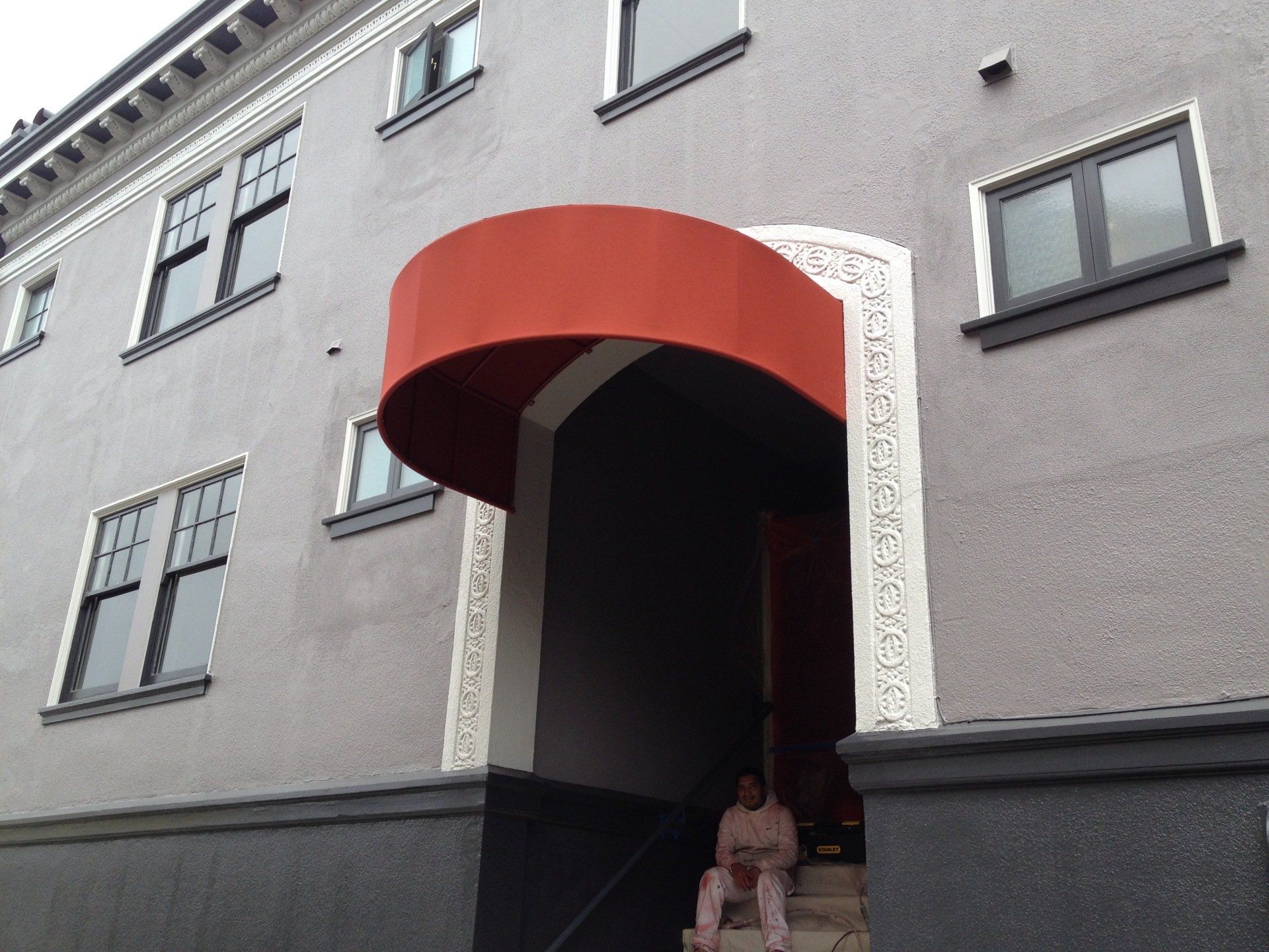 A building with a red awning over the entrance