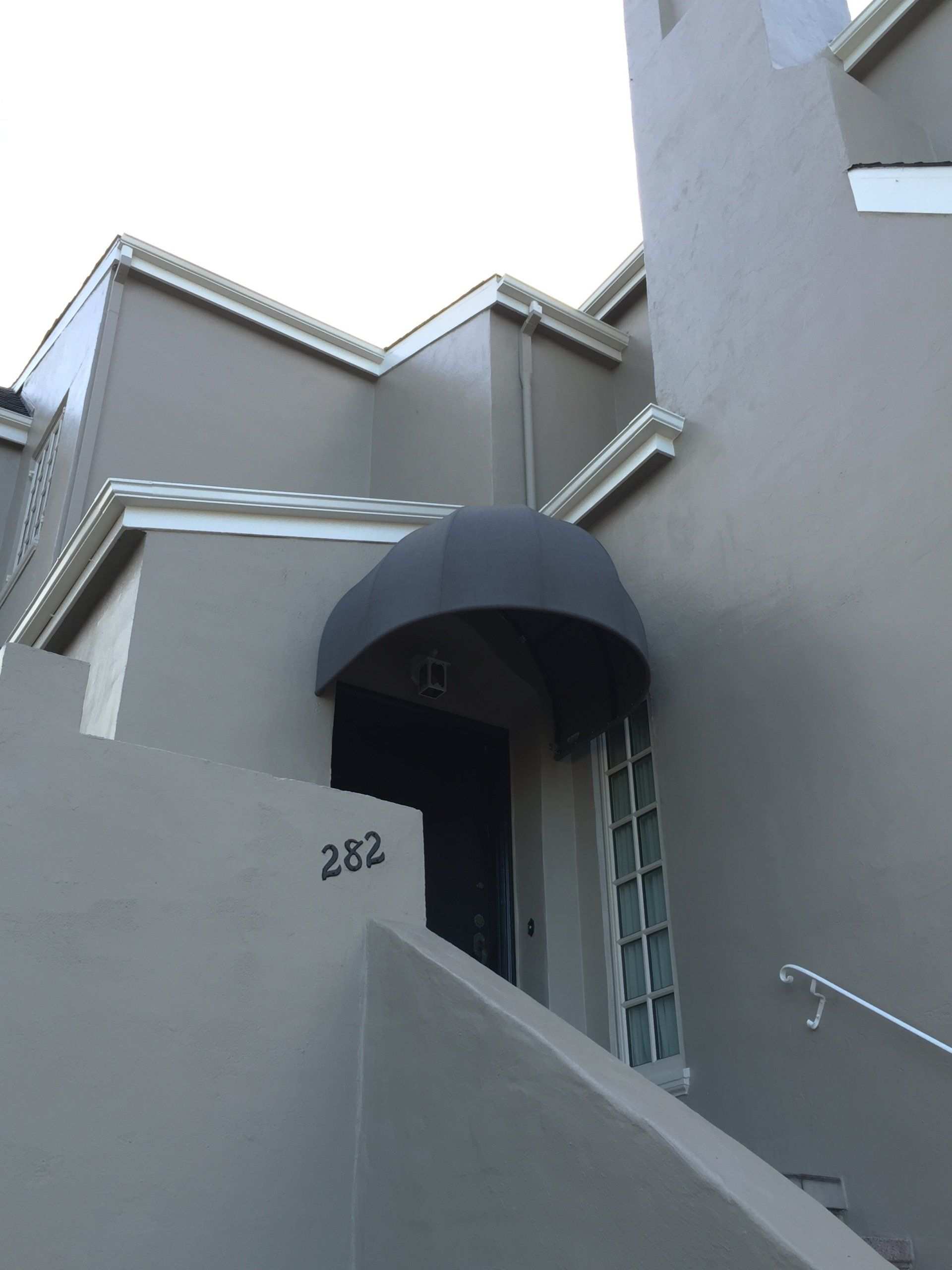 The number 232 is on the side of a building