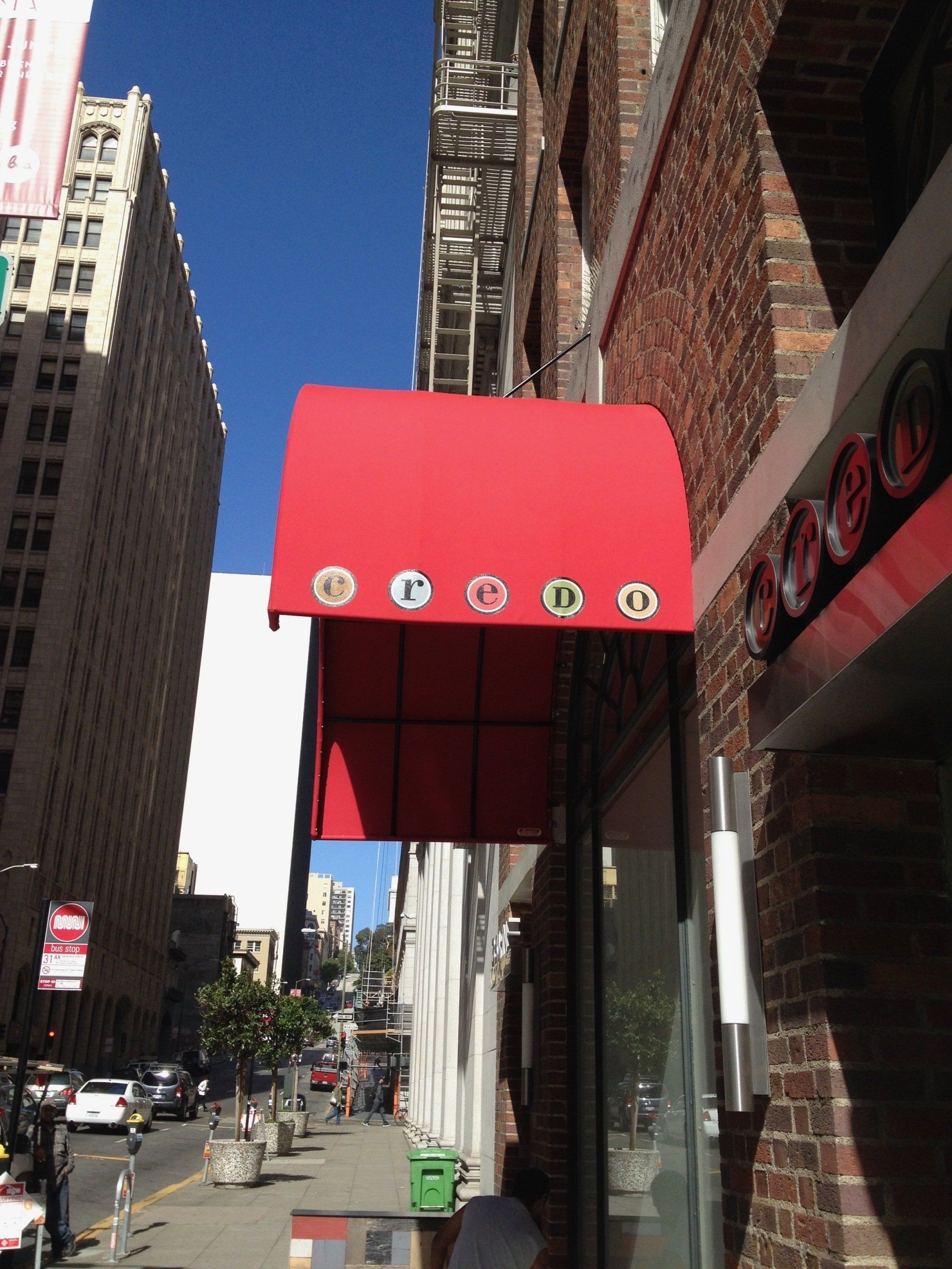 A red awning on the side of a building