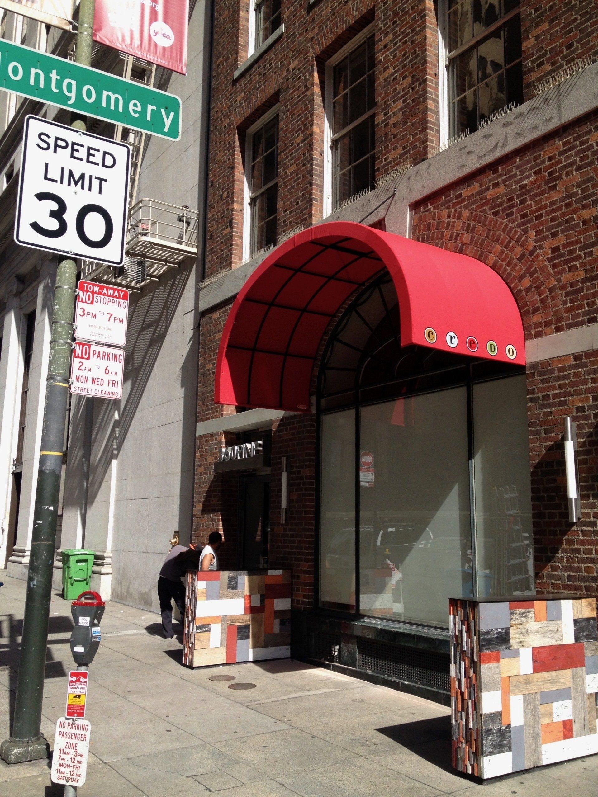 A brick building with a speed limit of 30