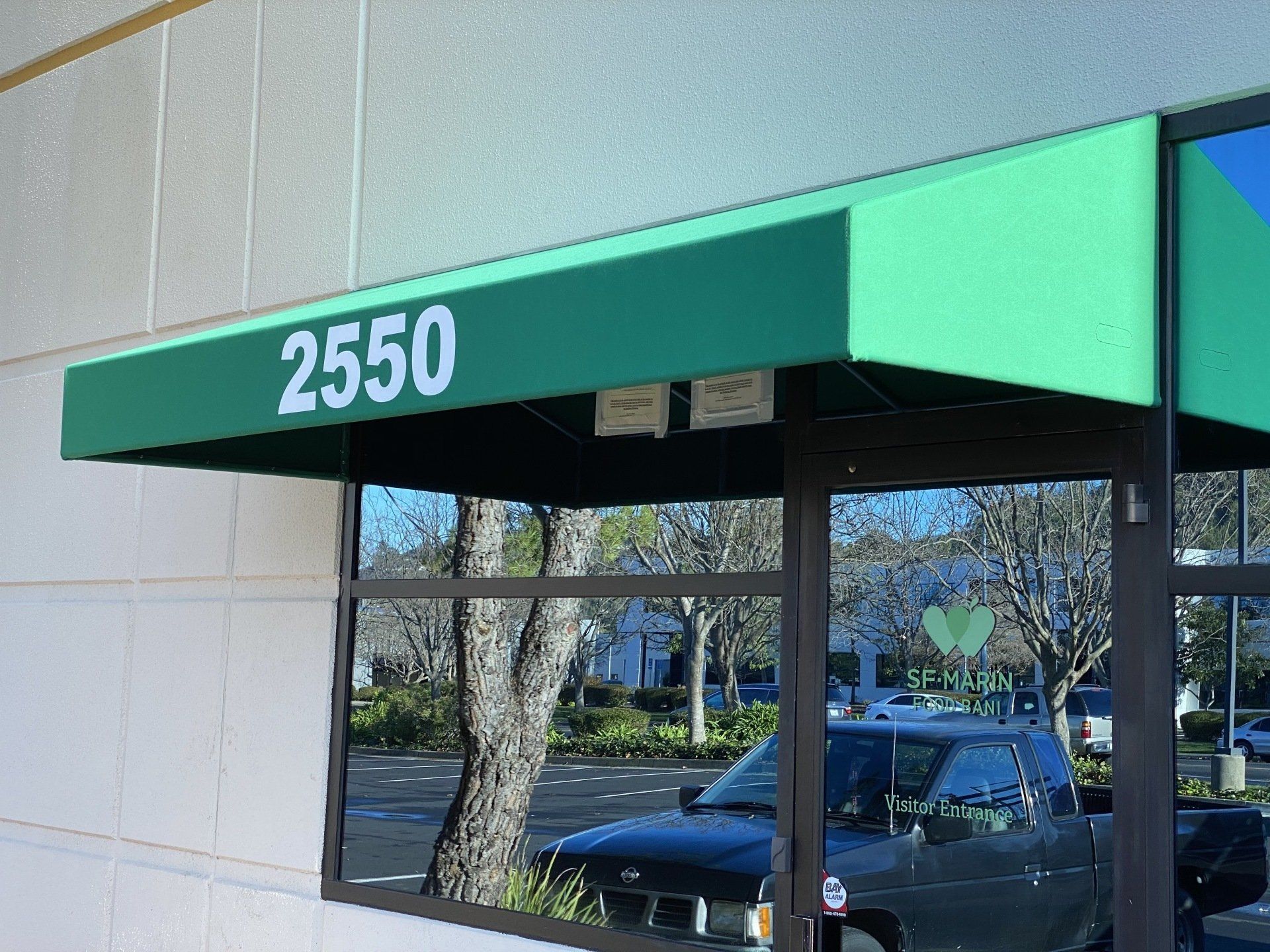 A green awning with the number 2550 on it