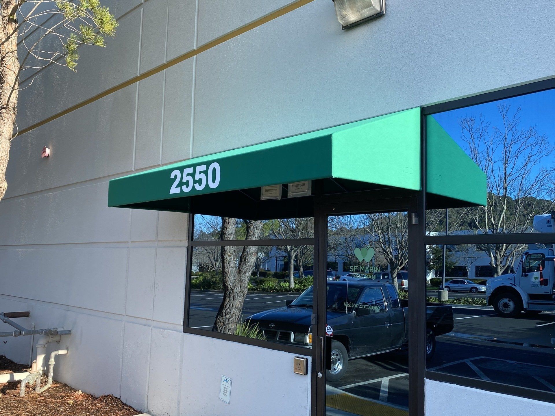 A green awning with the number 2550 on it