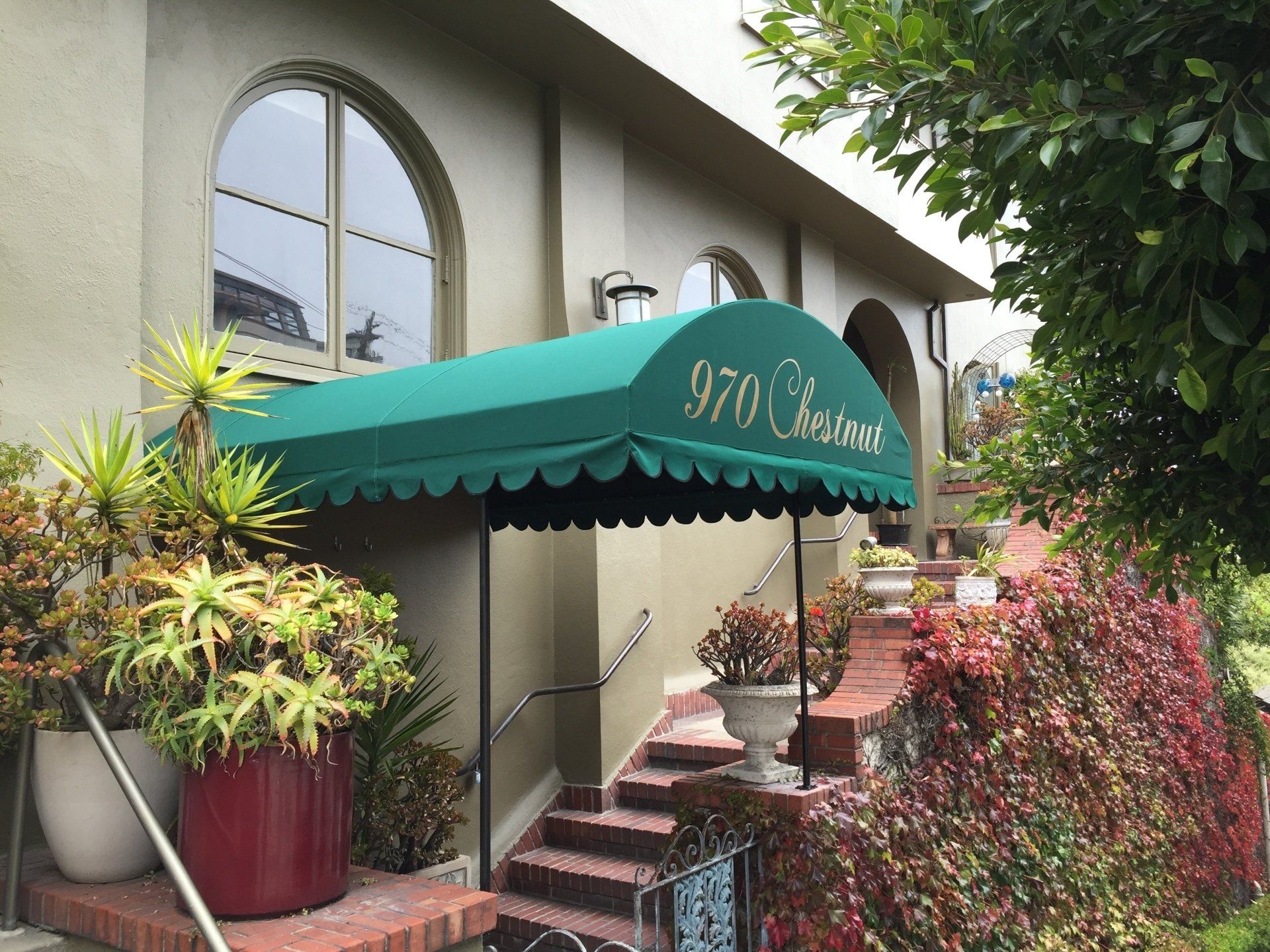 A building with a green awning over the entrance