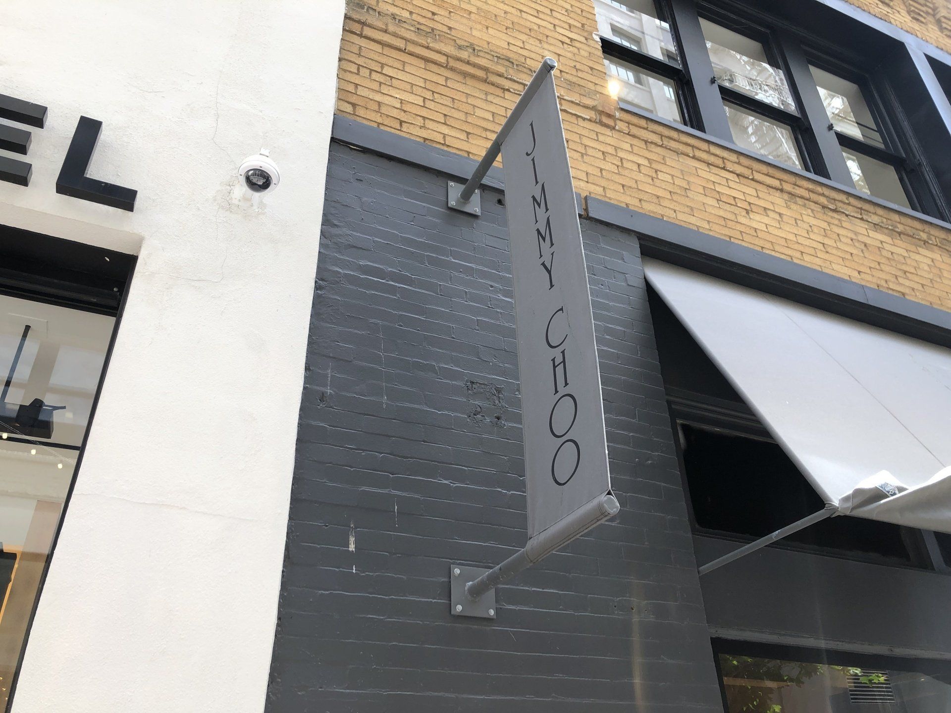 A sign on the side of a building says coco