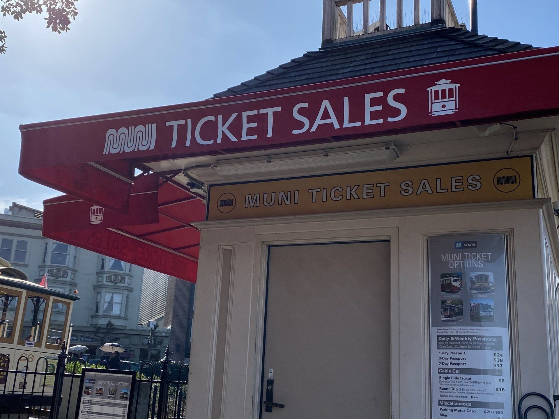A building with a sign that says ' sticky ticket sales ' on it
