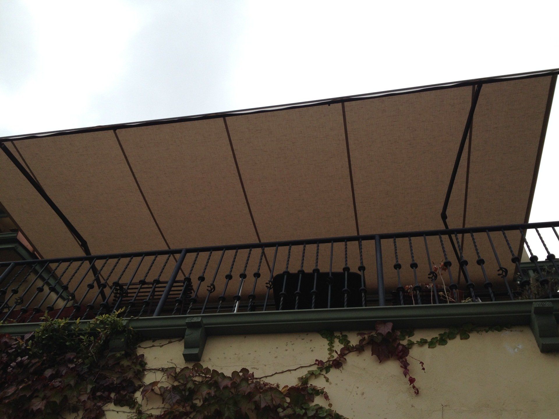 A balcony with a large awning over it