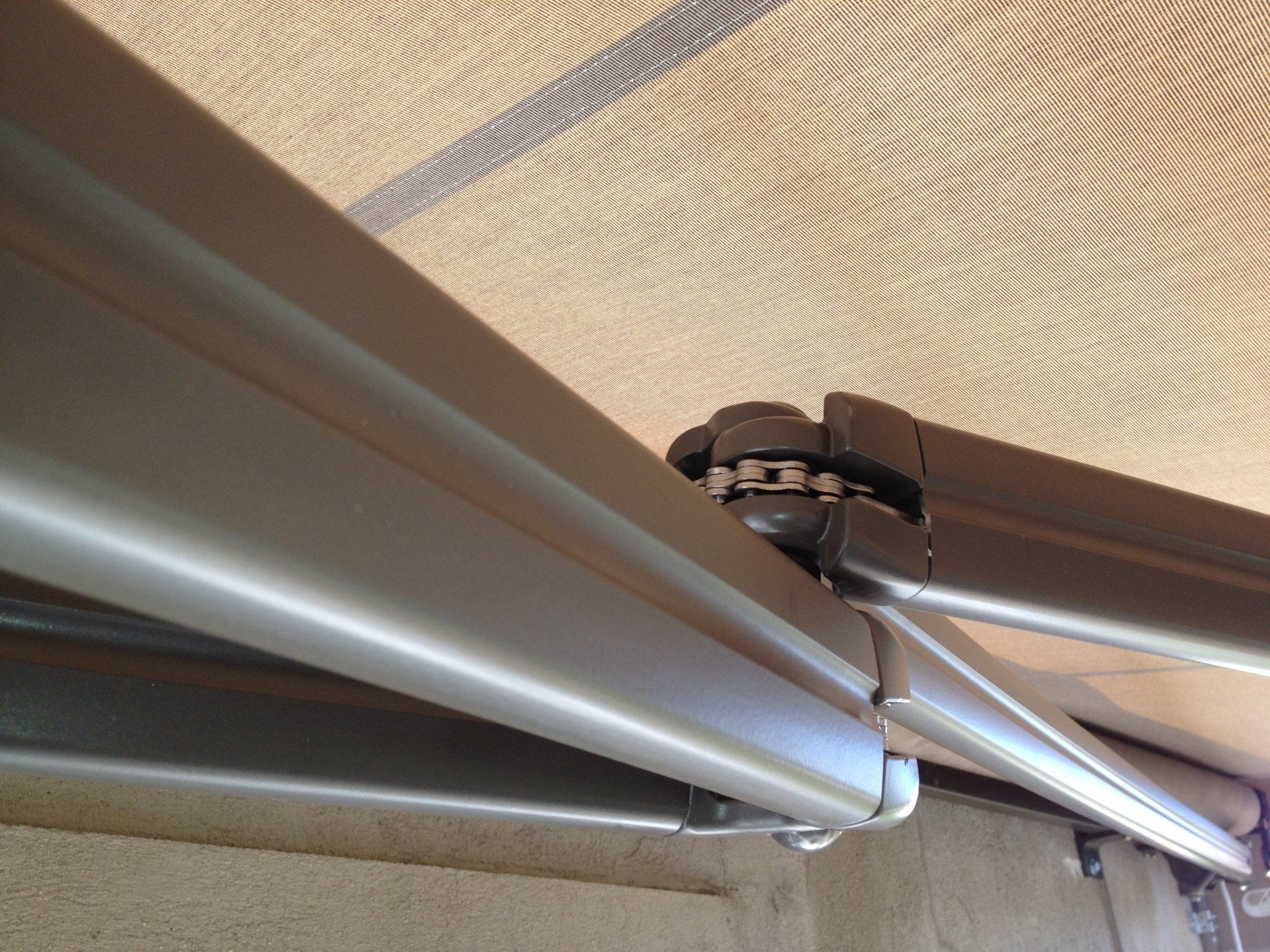 A close up of an awning with a metal frame
