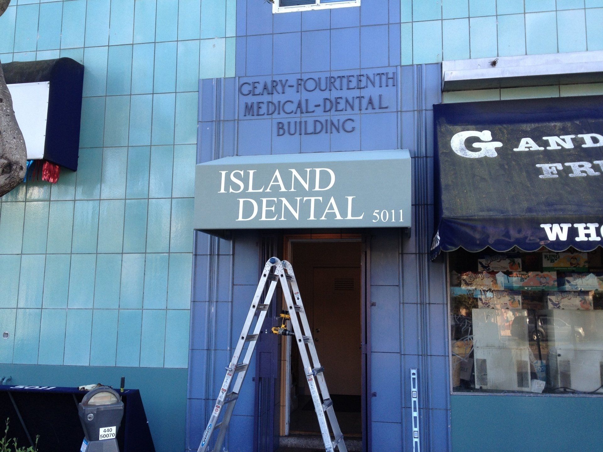 An island dental building with a ladder in front of it