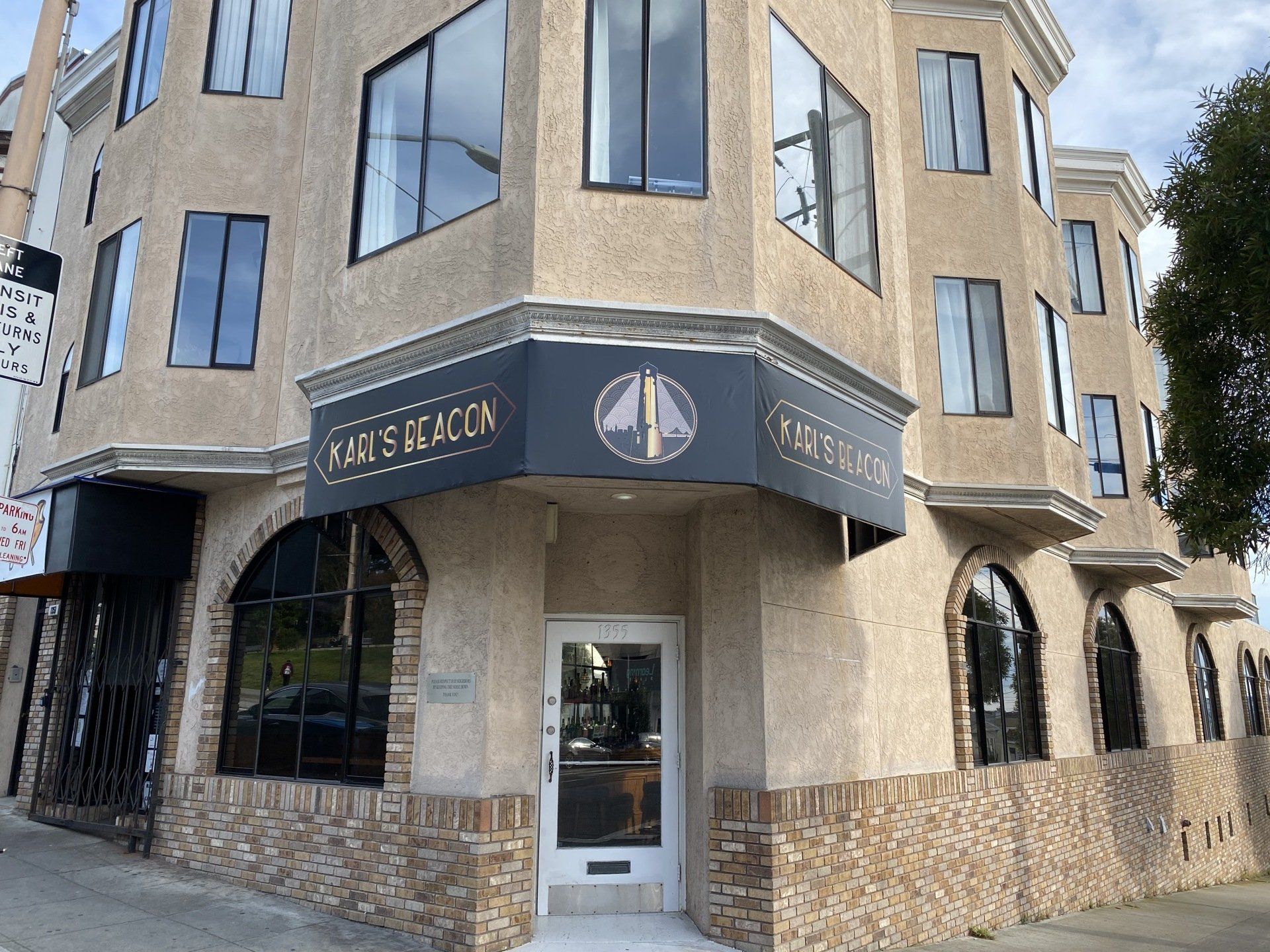 A building with a sign that says ' pearls of beacon ' on it