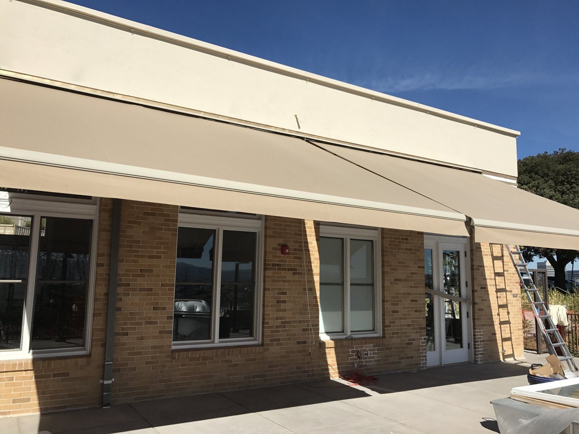 A brick building with a large awning over it