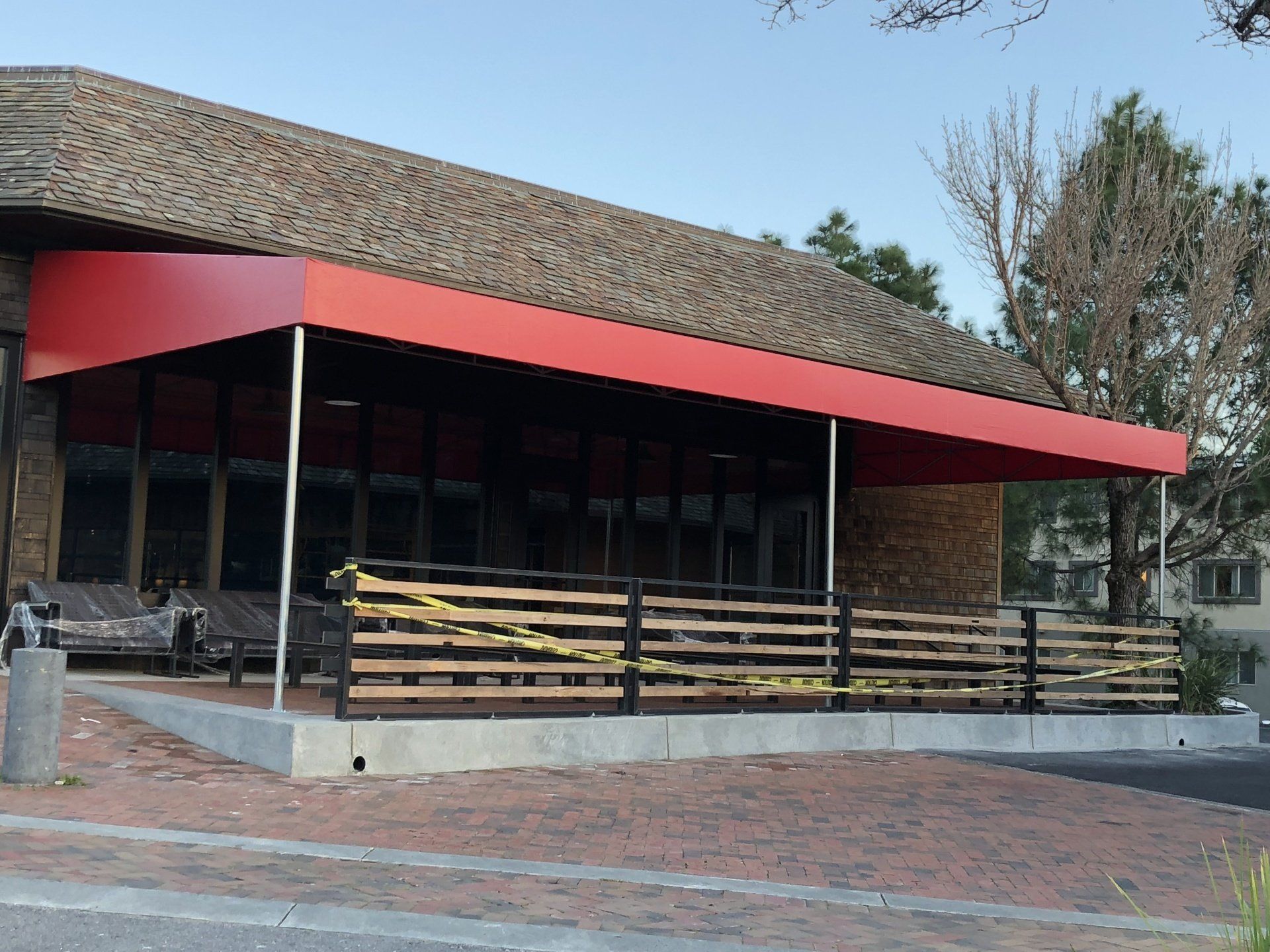 A building with a red awning on top of it