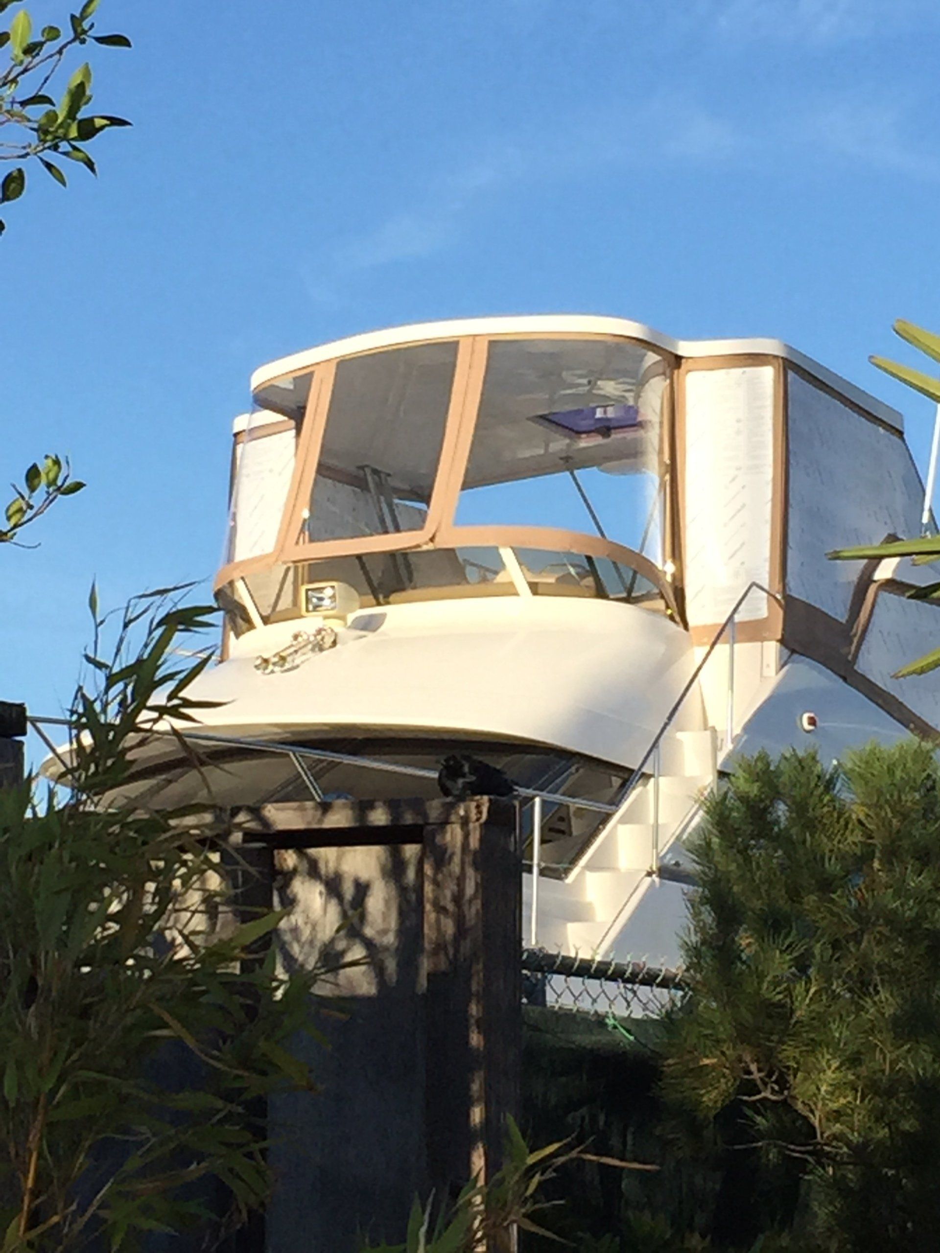 A white boat with stairs leading up to it