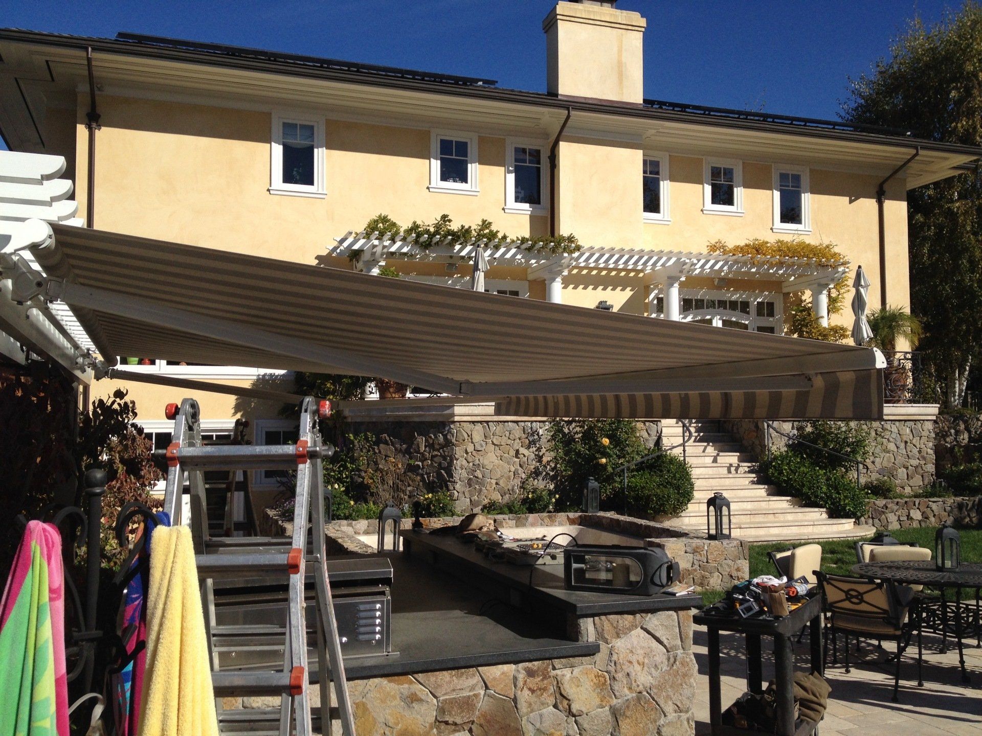A large house with a ladder in front of it