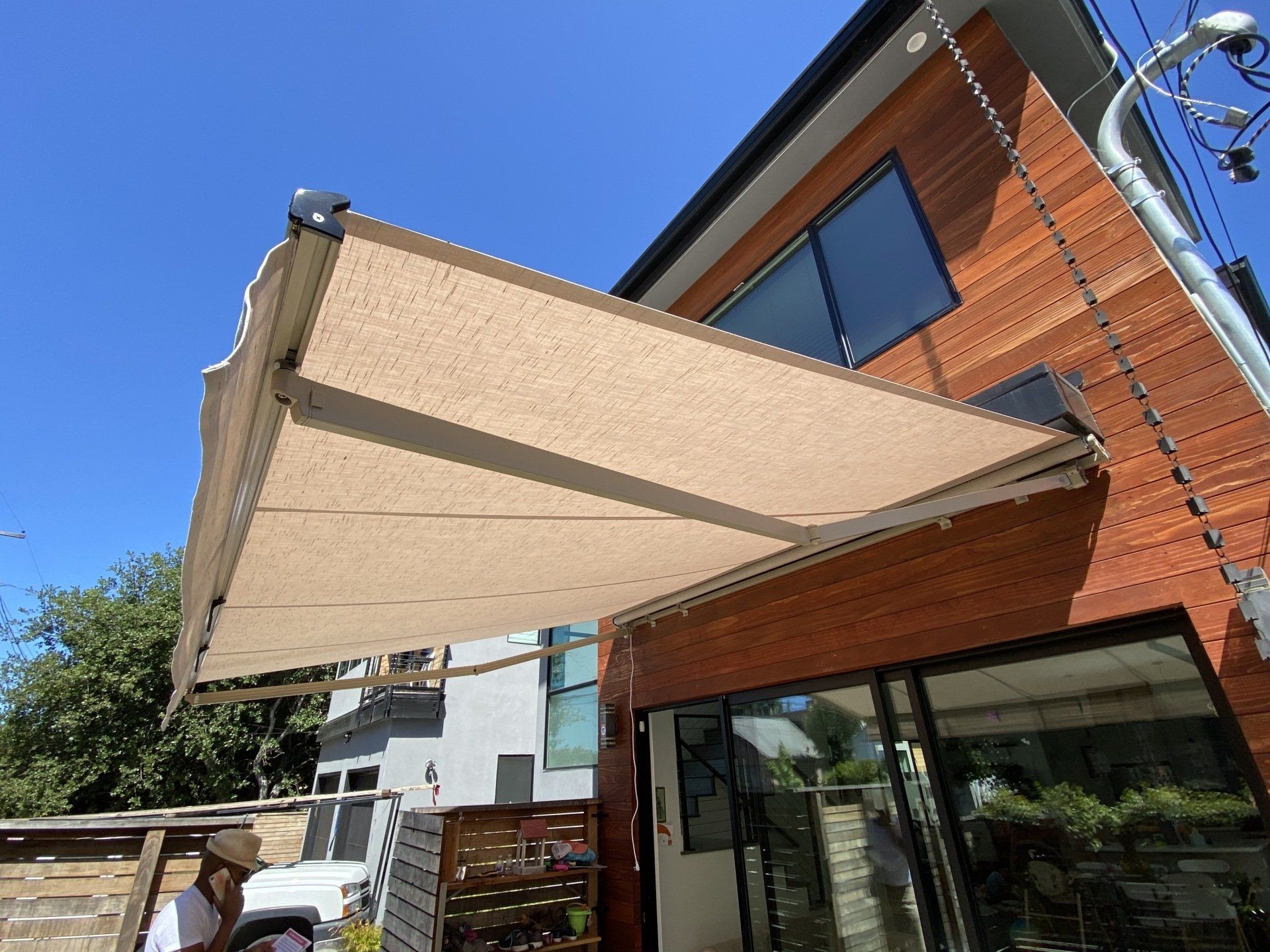 A large awning is hanging from the side of a building