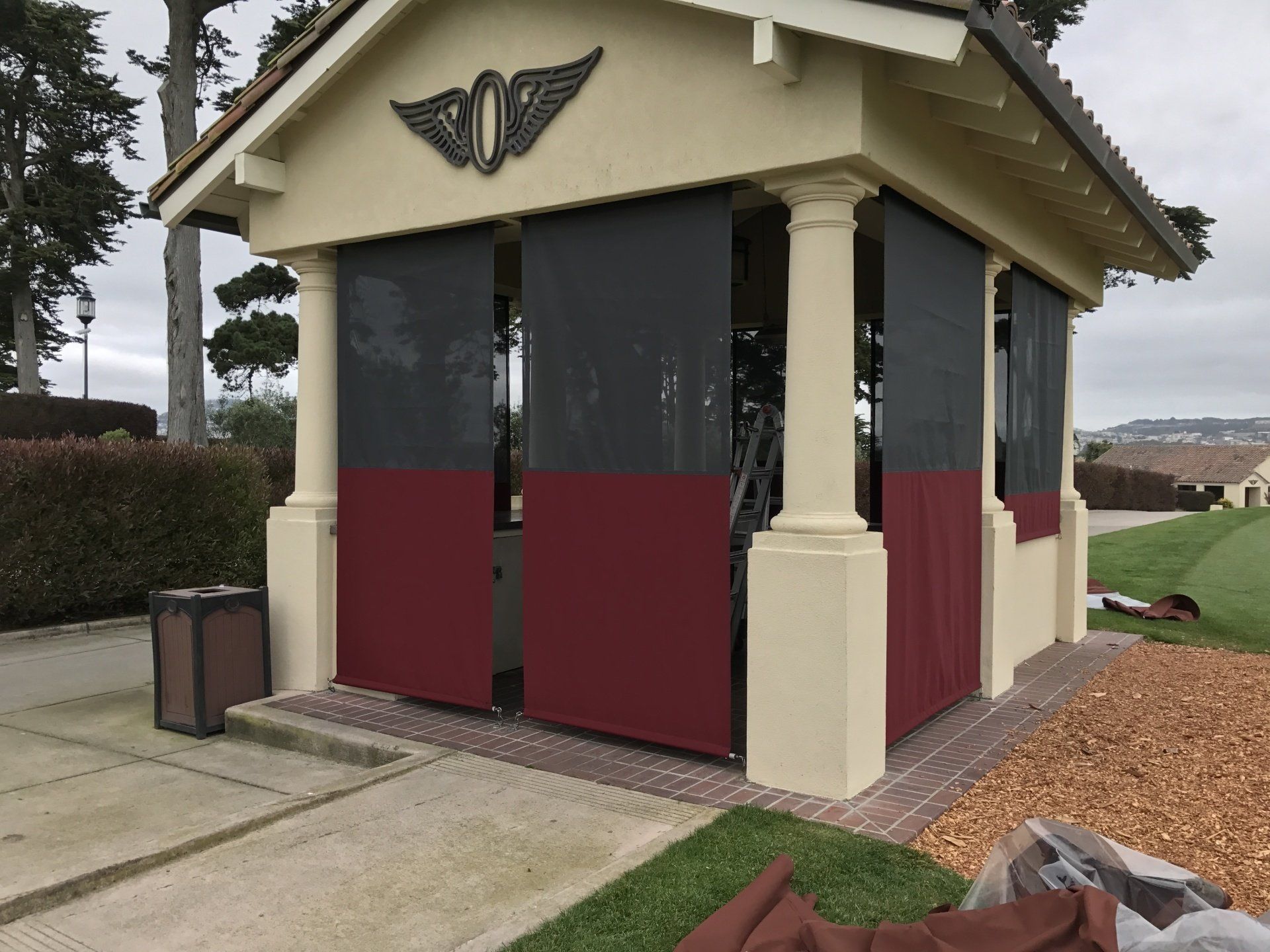 A building with a wing on the top of it