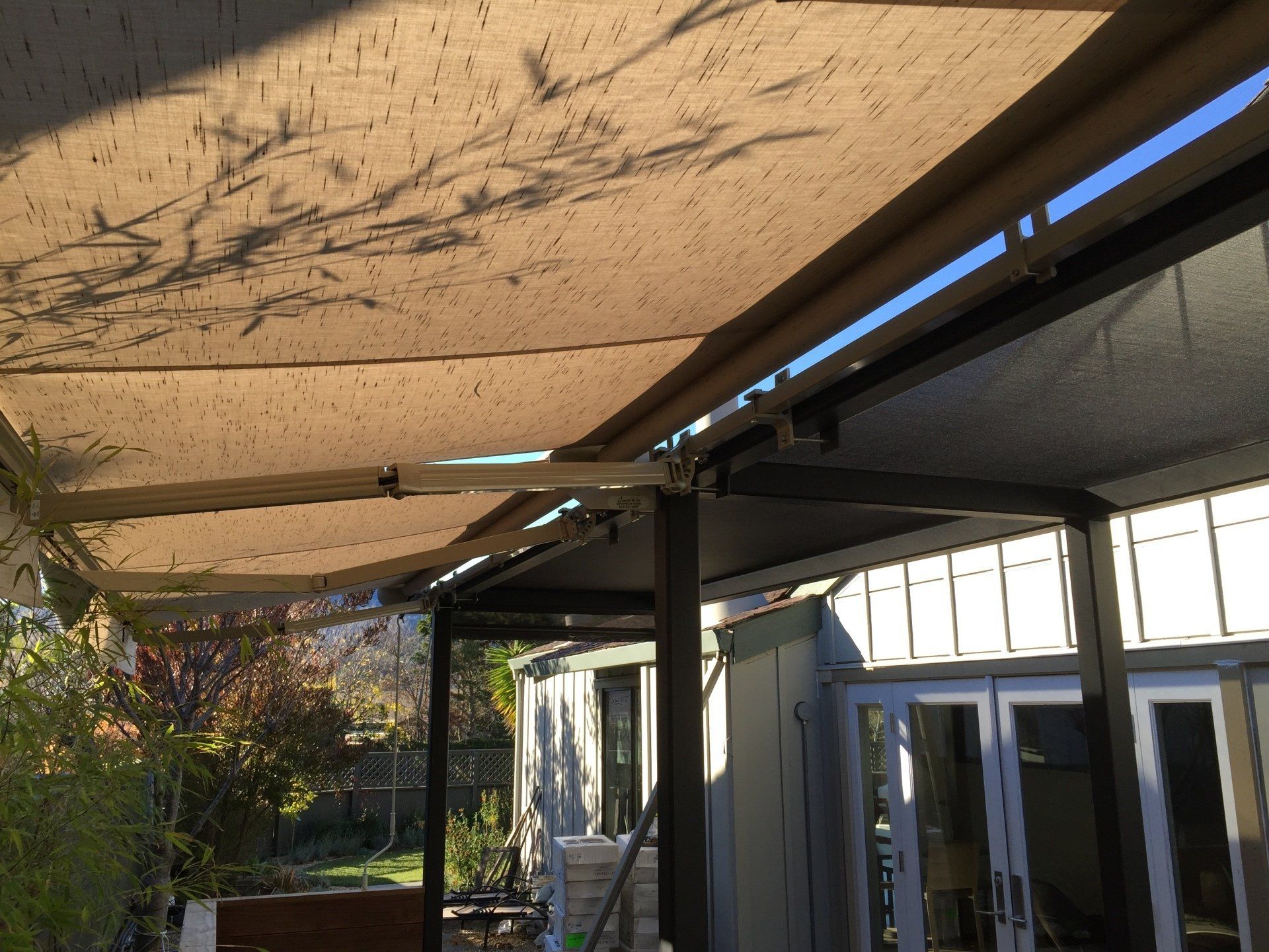 A patio with a large awning over it