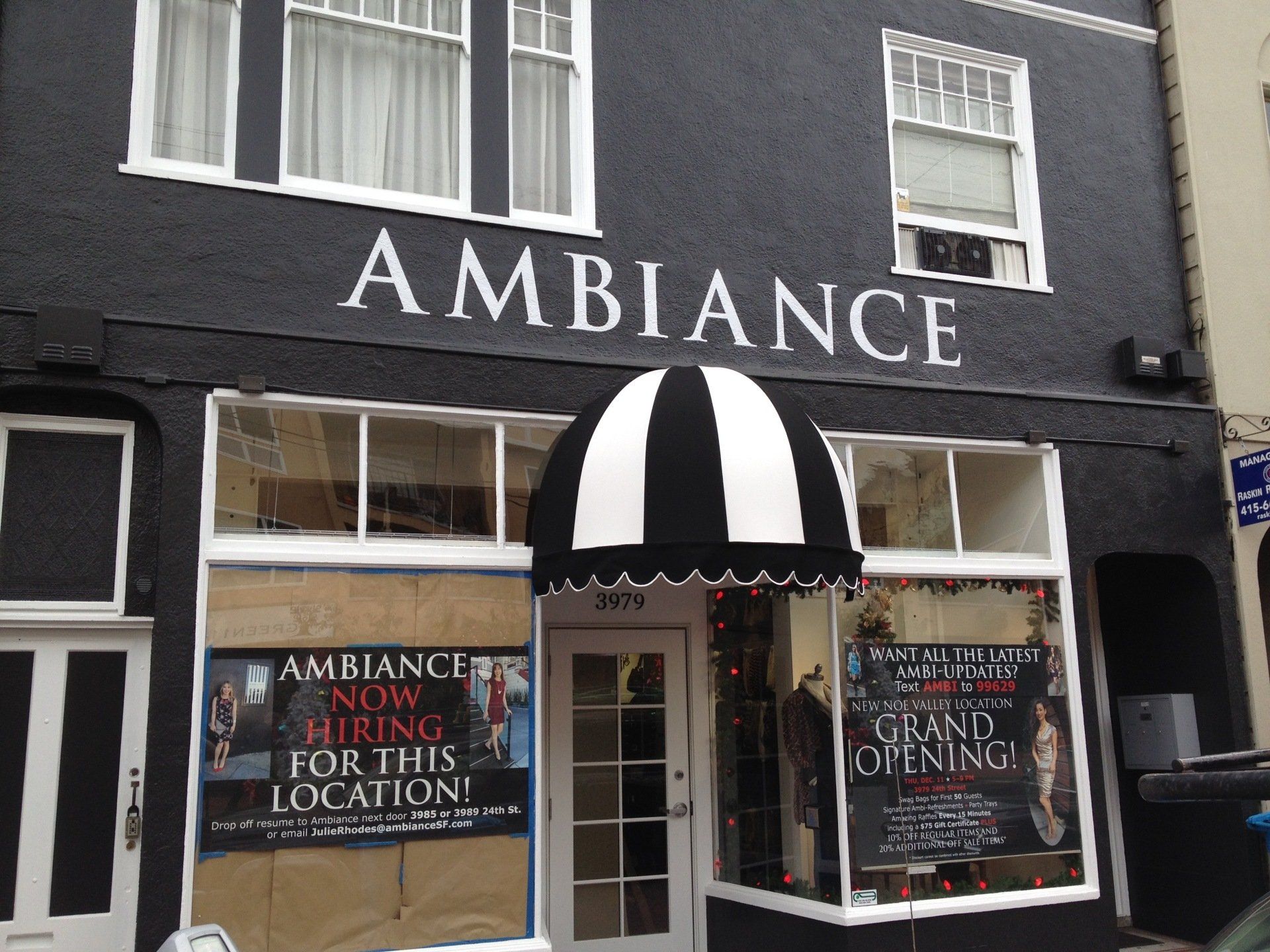 A black building with the word ambiance on it