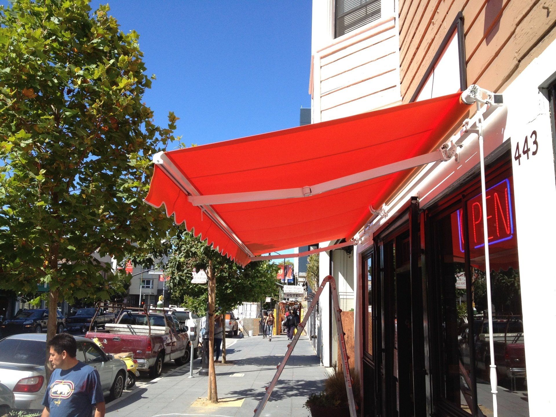 A red awning with the number 443 on it
