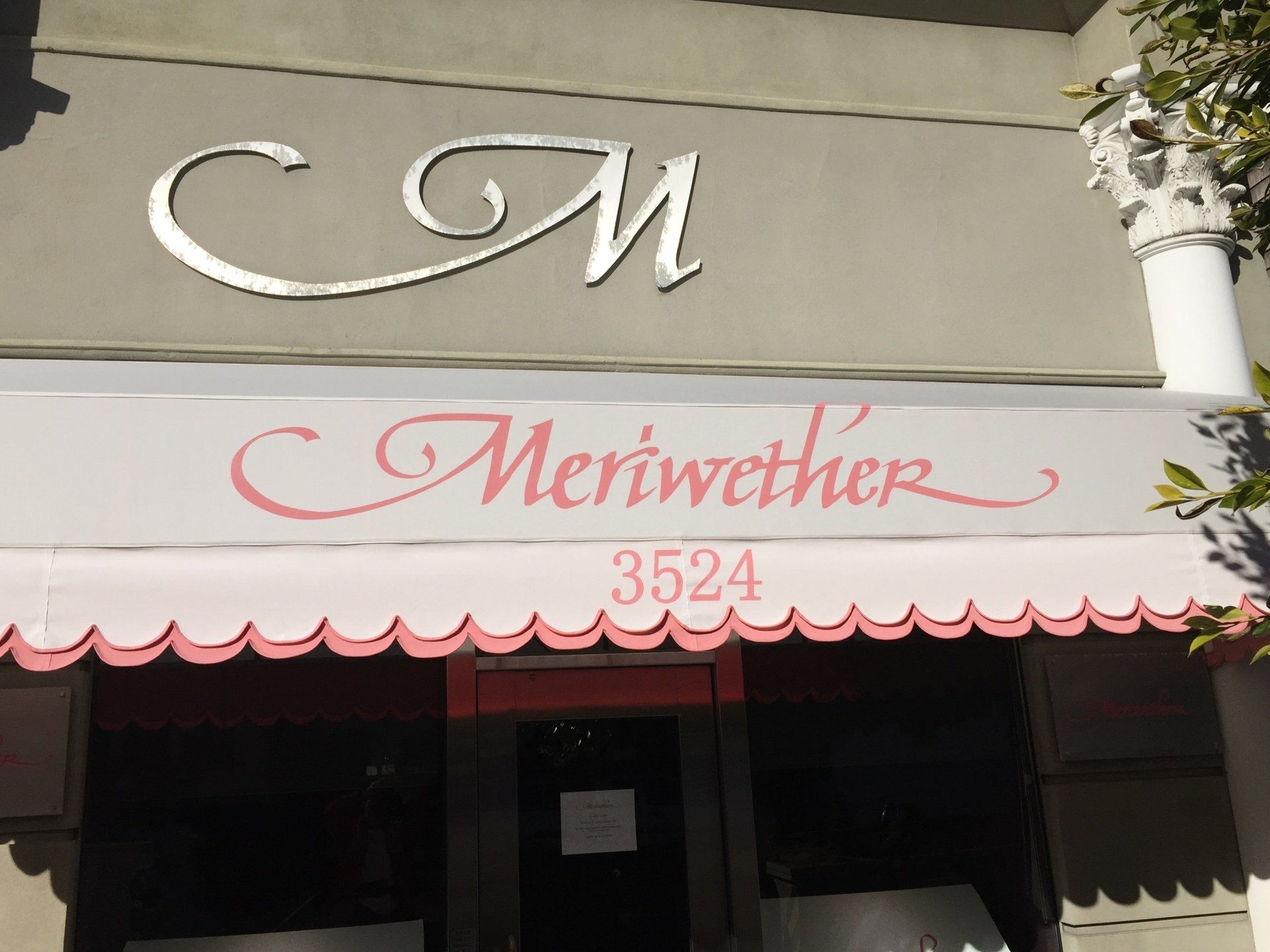 A store front with the name meriwether on it
