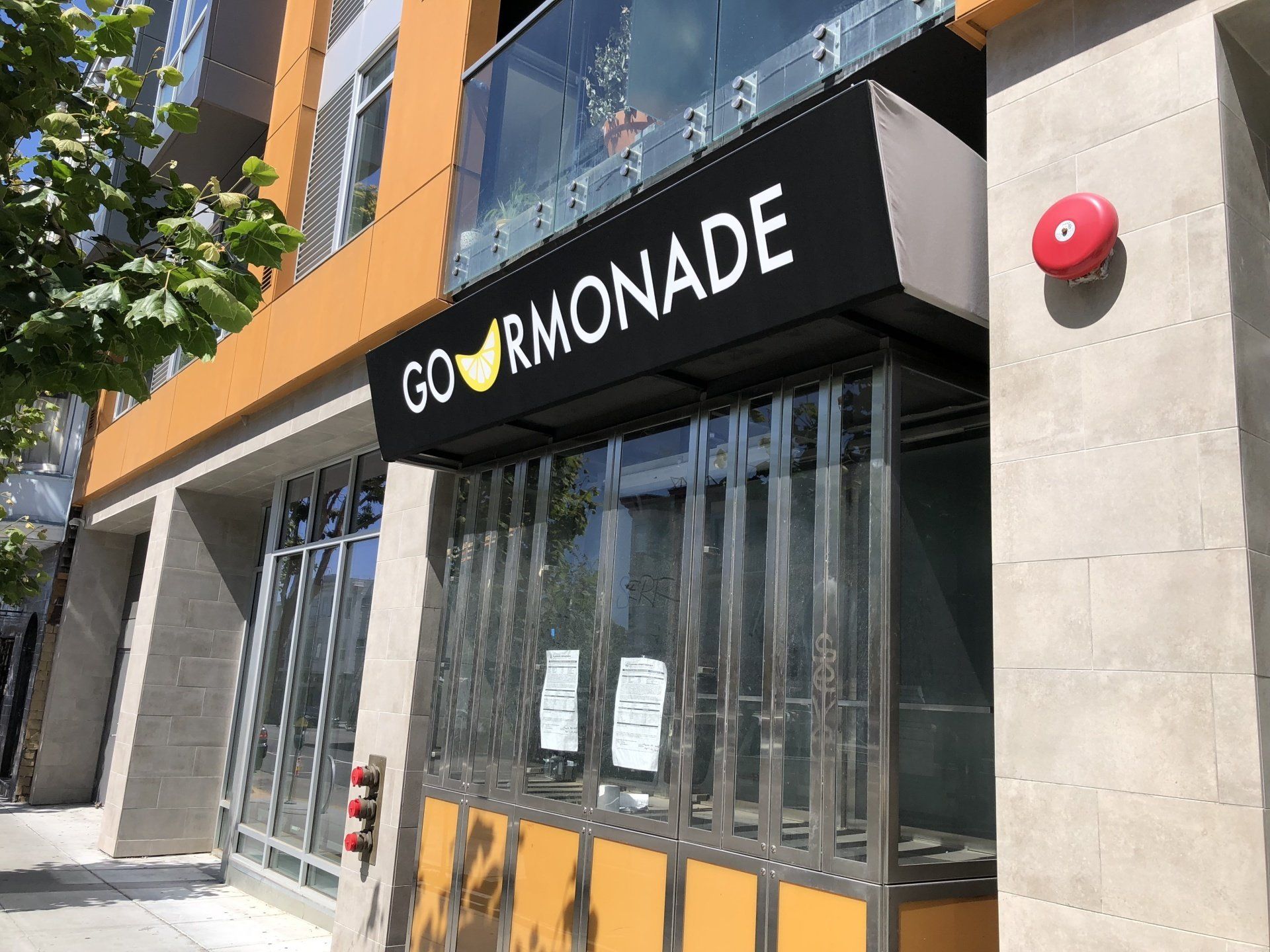 A building with a sign that says gourmonade on it