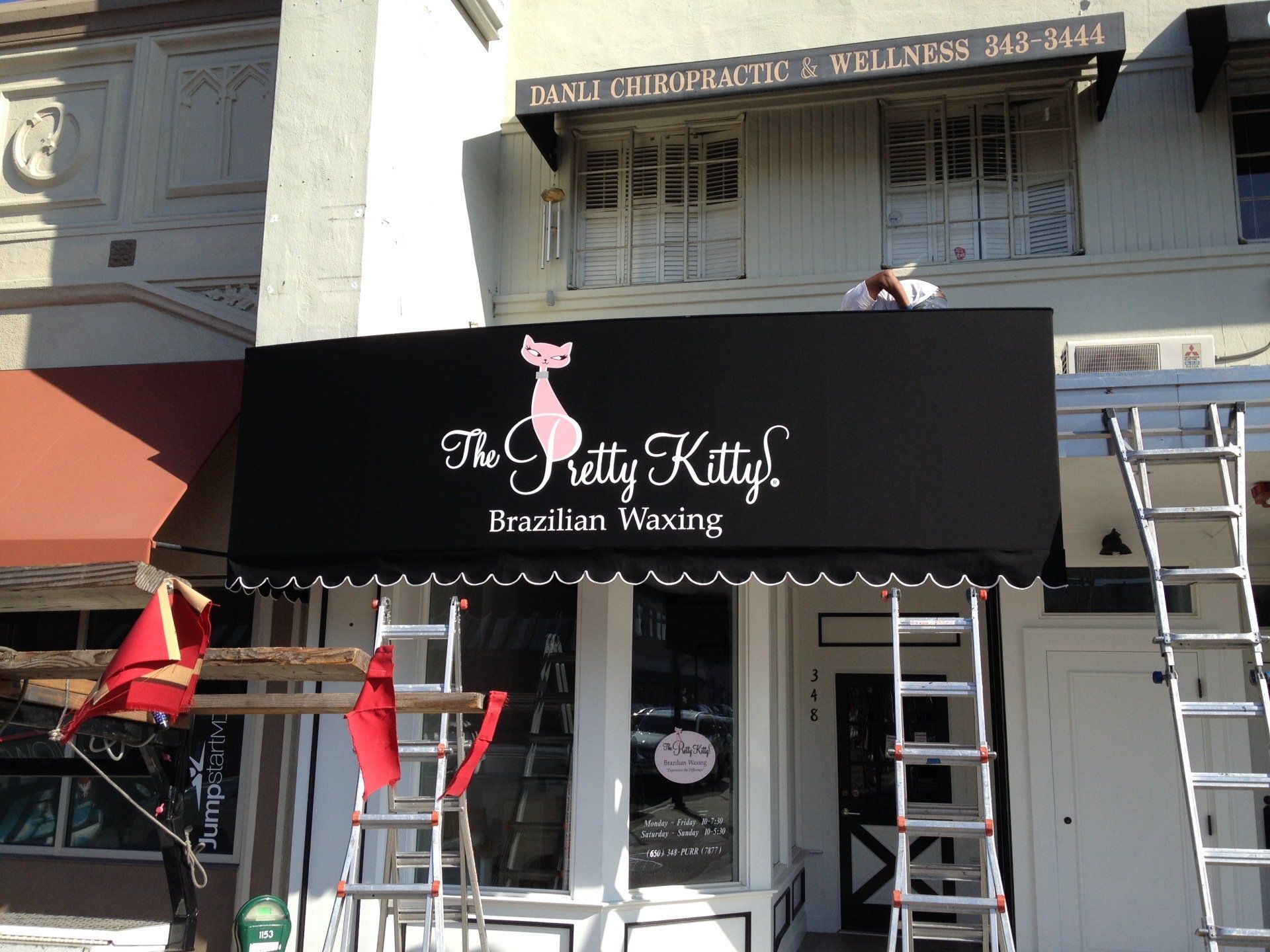 A black awning for the pretty kitty brazilian waxing