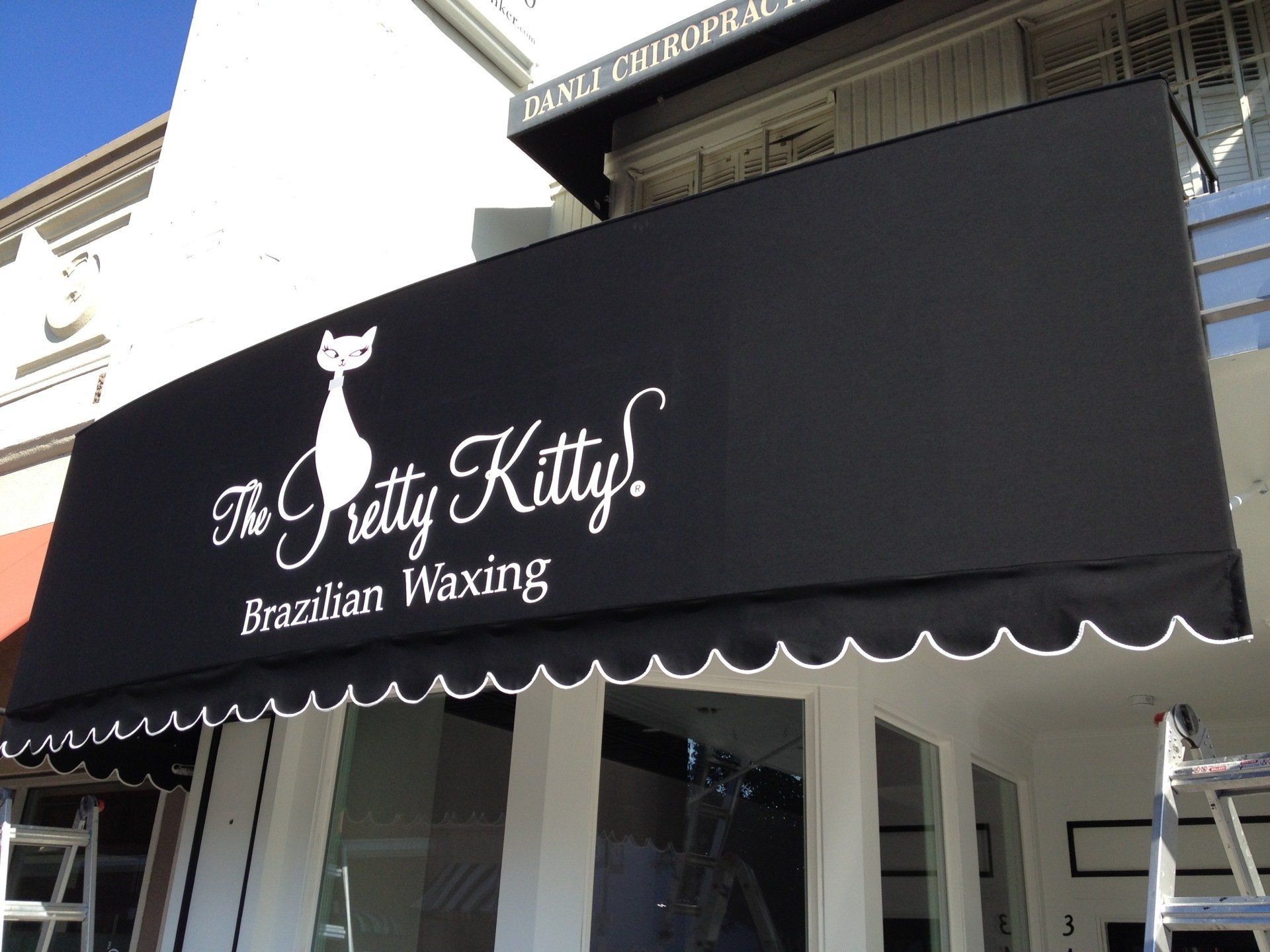 A black awning for the pretty kitty brazilian waxing