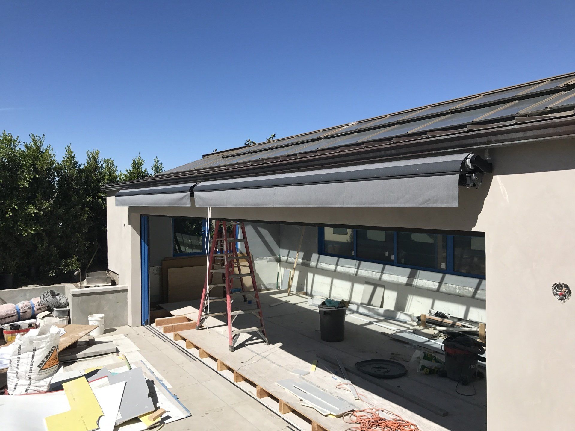 A house under construction with a ladder in front of it