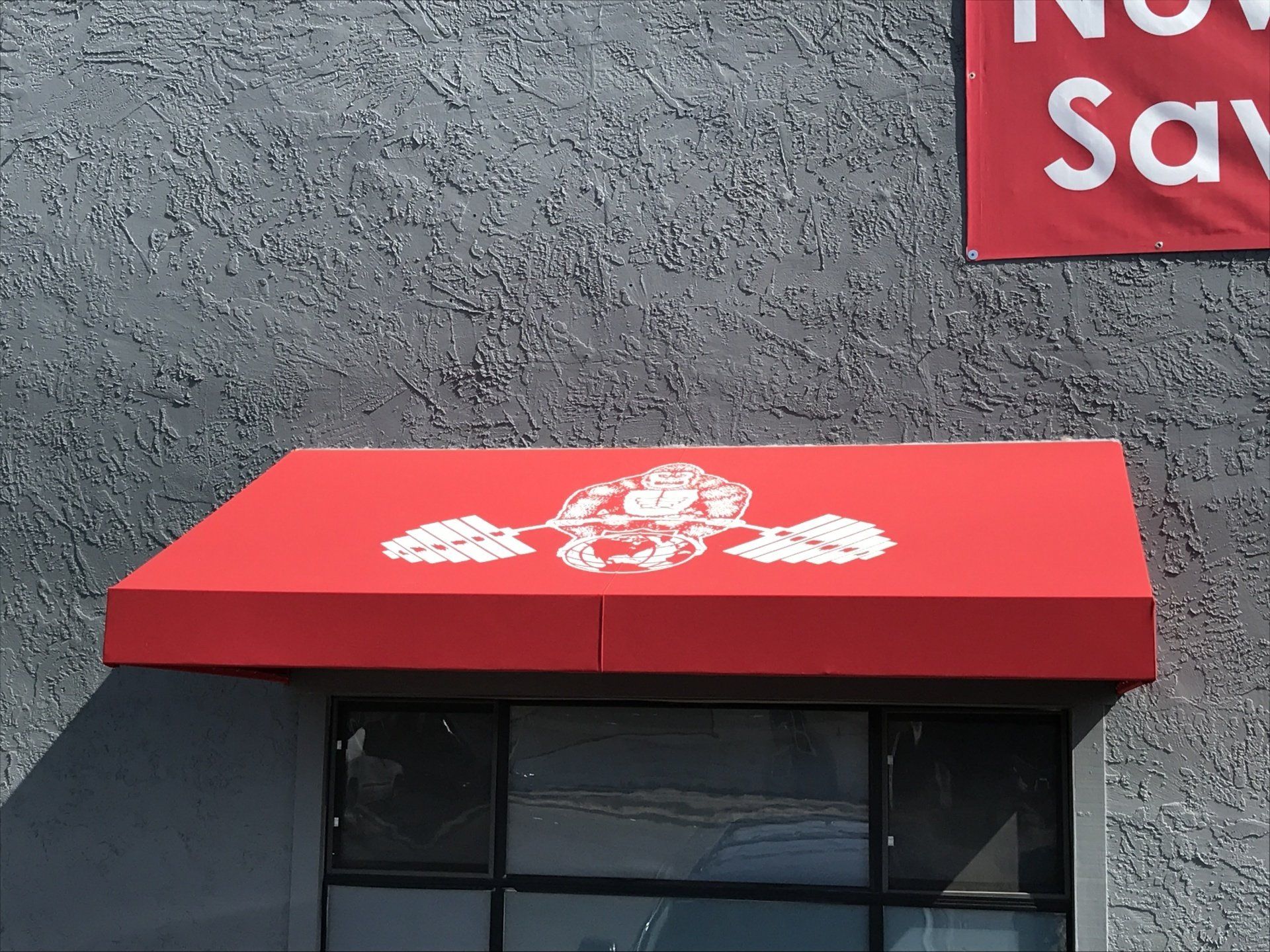 A red awning on the side of a building