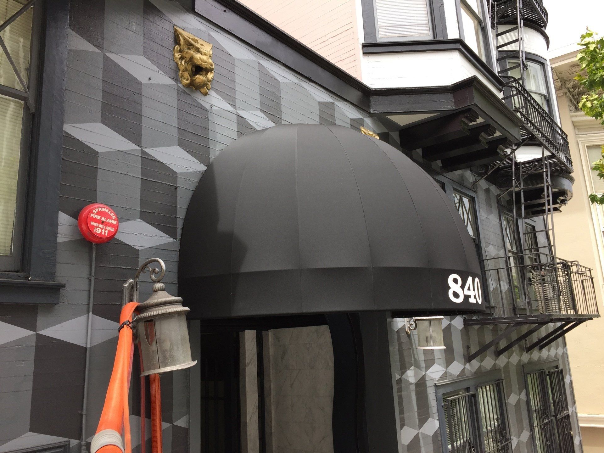 A black awning with the number 844 on it