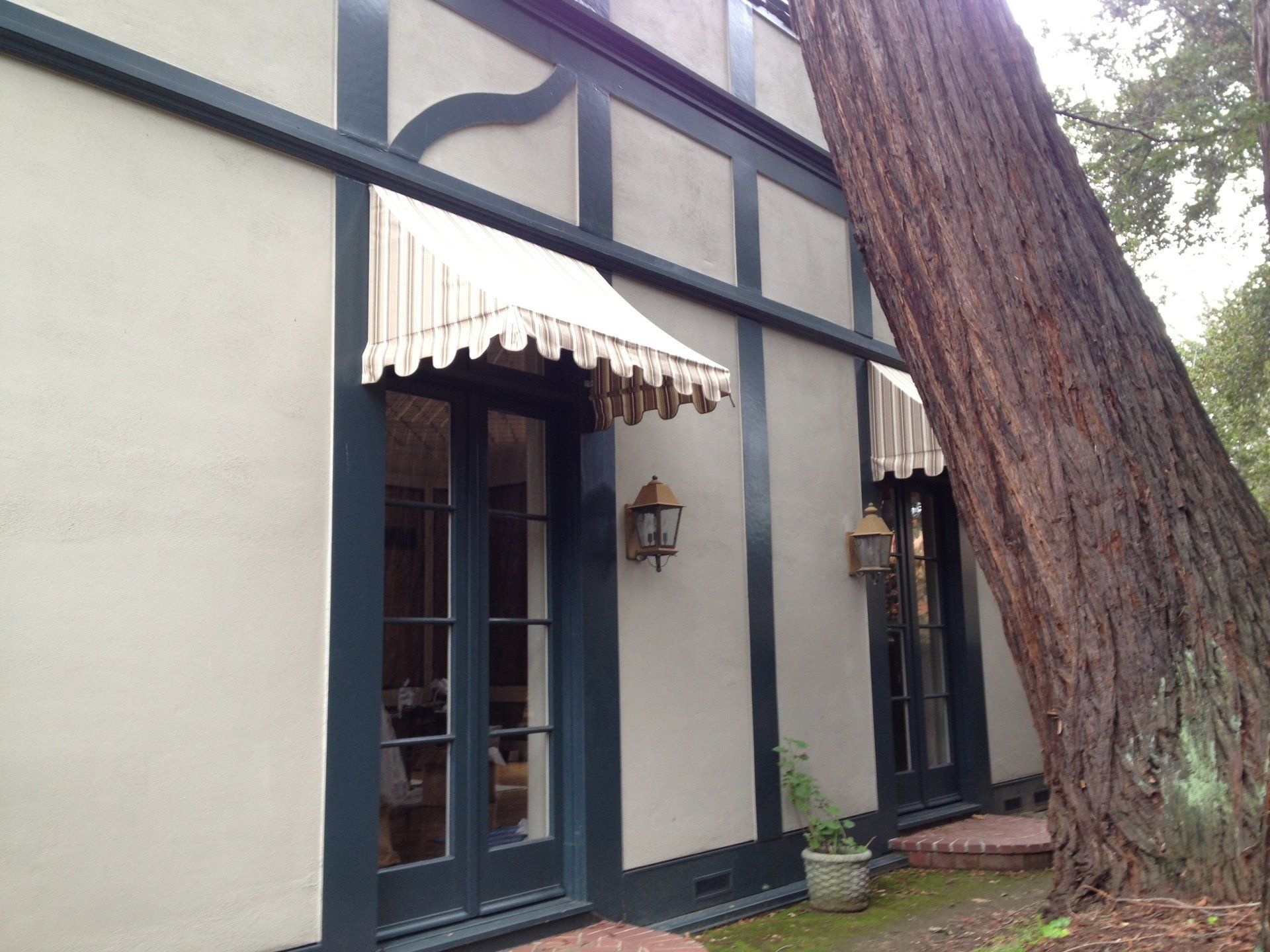 A house with a white awning over the front door