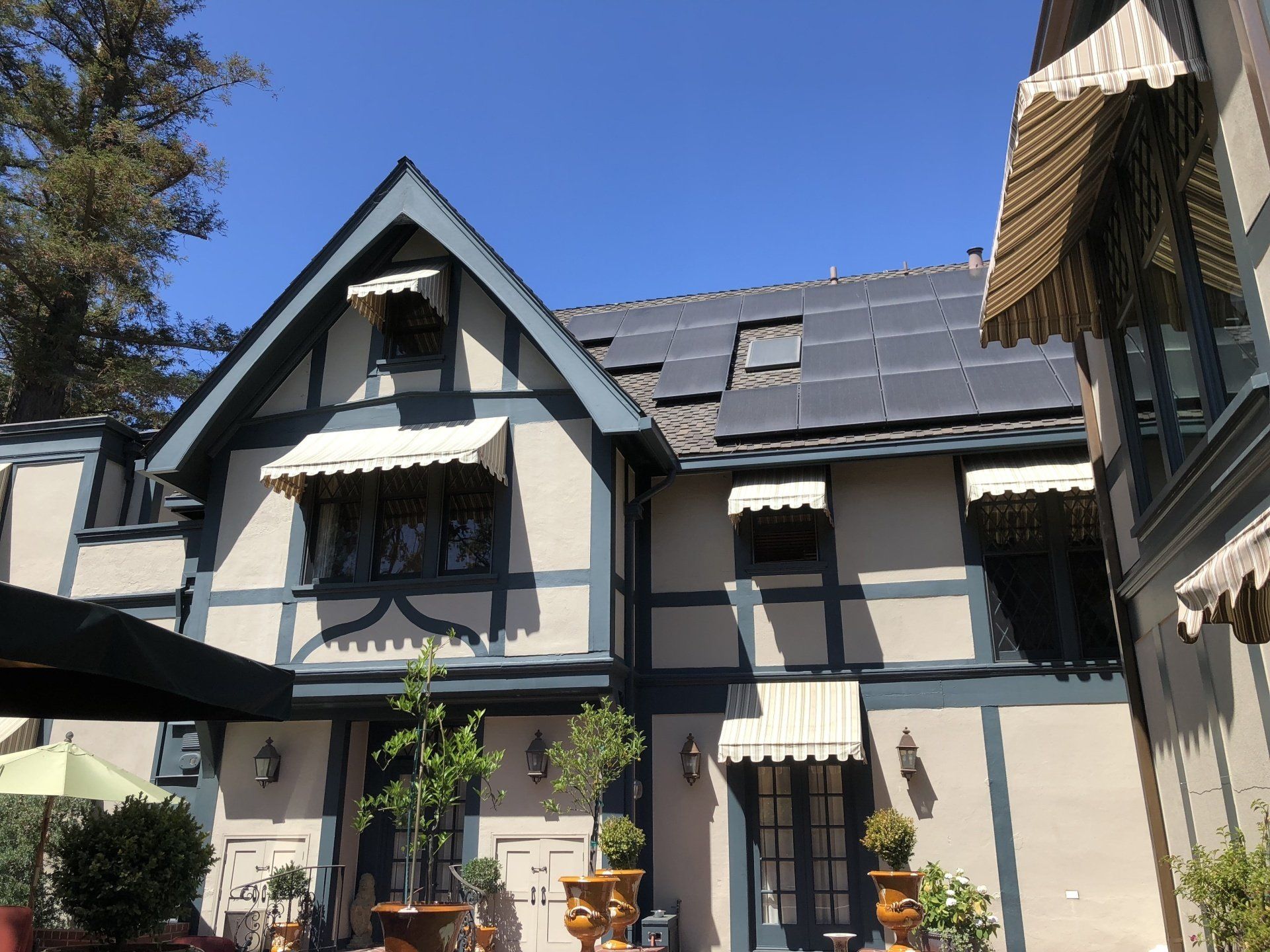A large house with solar panels on the roof