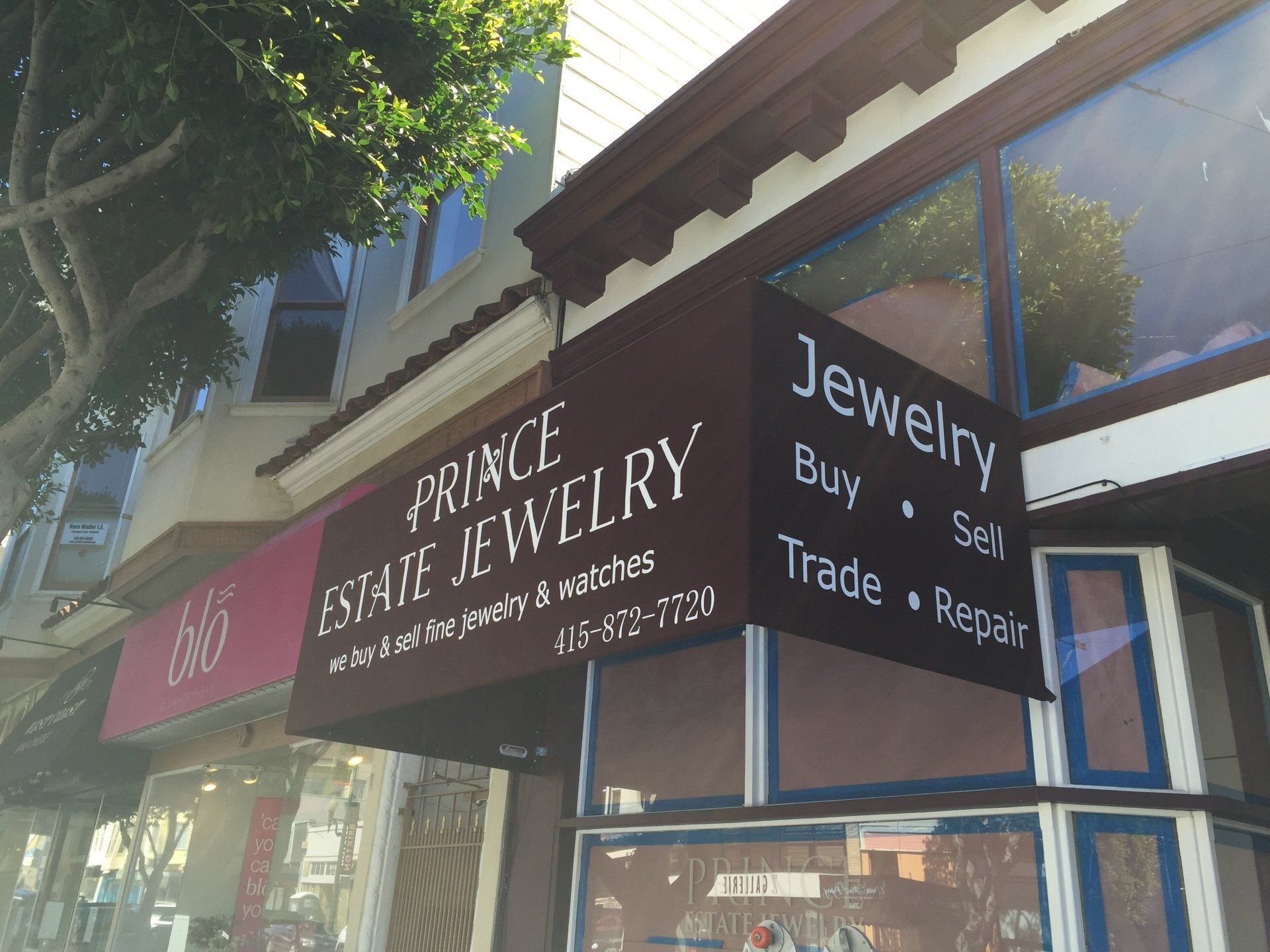 A store front with a sign that says prince estate jewelry