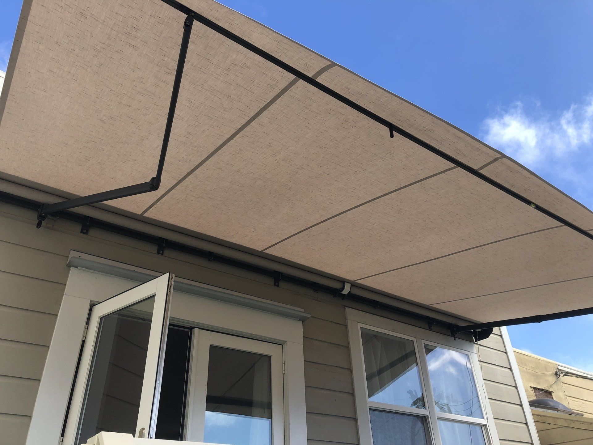 A house with a large awning over a window