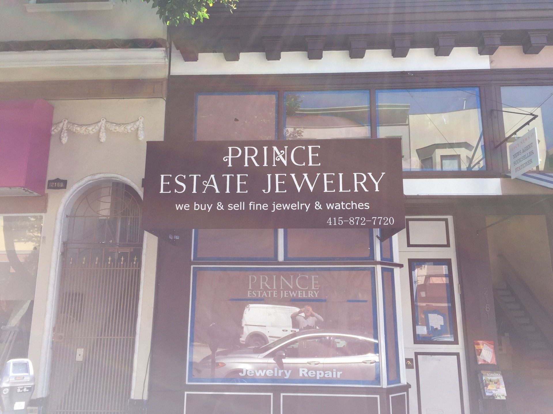 A store front with a sign that says prince estate jewelry