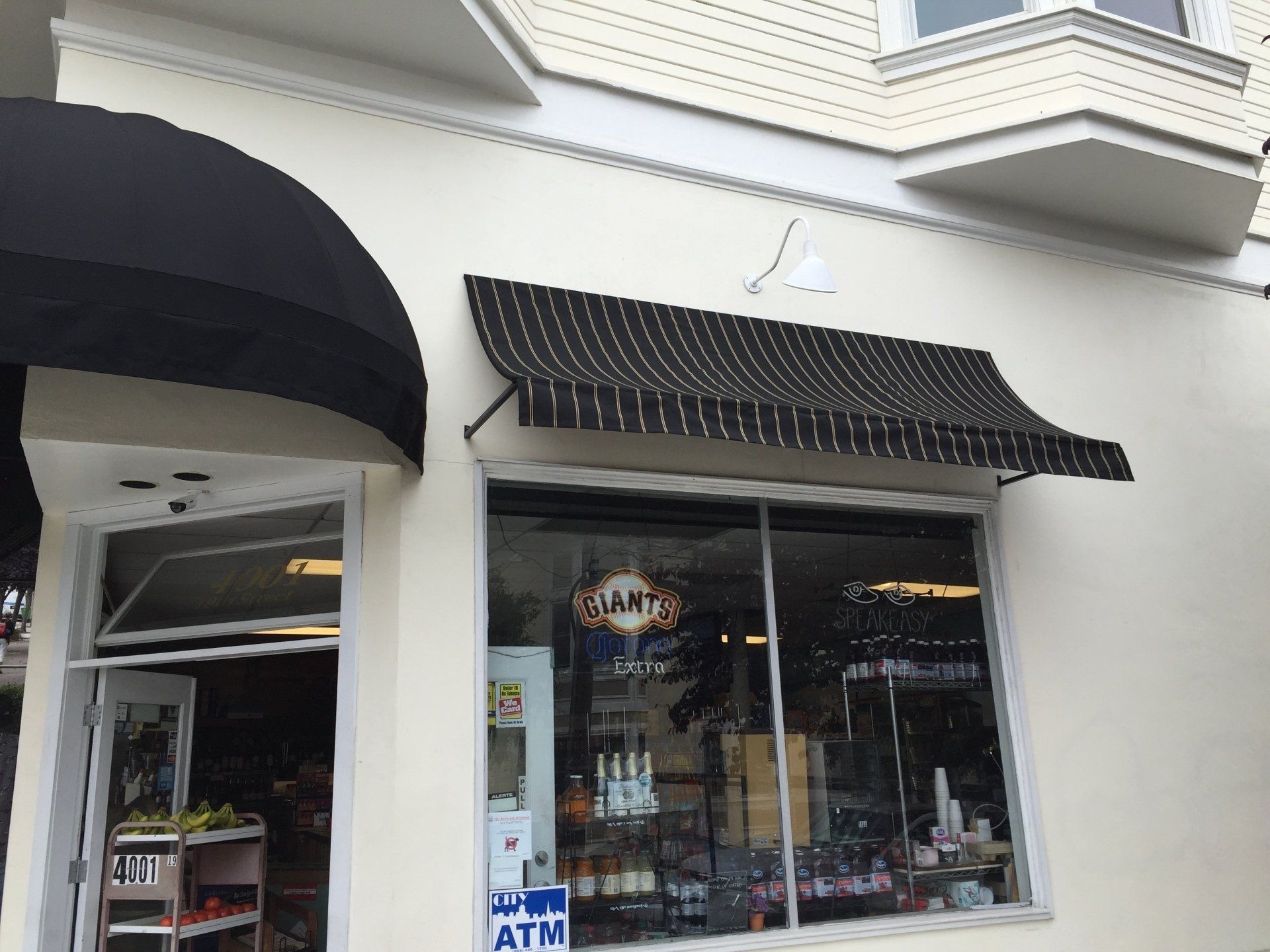 A store front with a sign that says atm on it