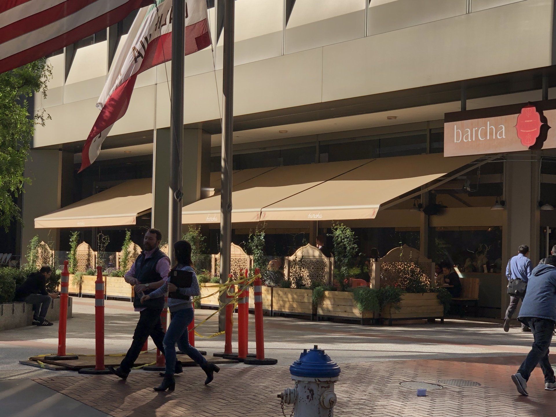 People are walking in front of a laicha restaurant