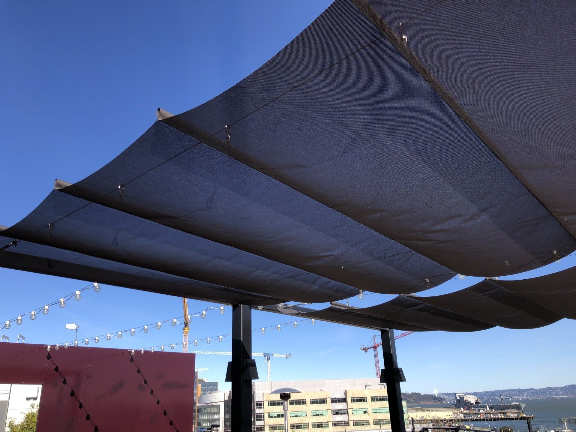 A large umbrella with a blue sky in the background